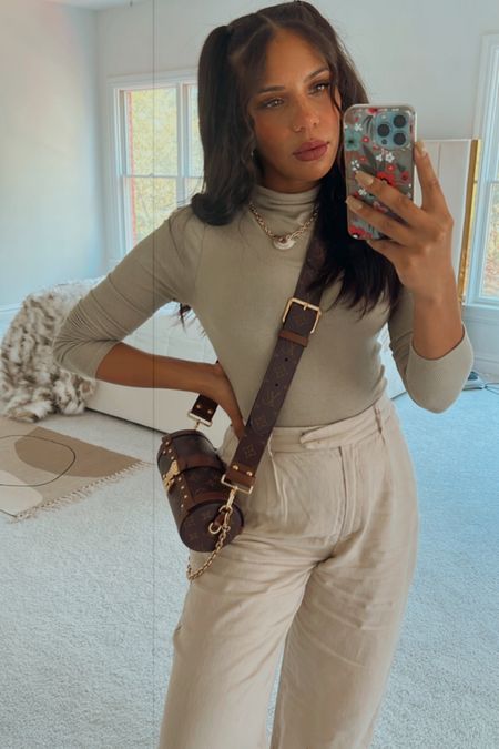 Fall outfit idea, sage green turtle neck bodysuit with high-waisted, wide-leg tan pants. Louis Vuitton Monogram Papillon trunk bag. Top and pants are originally ZARA, adding similar items from express and Abercrombie & Fitch  

#LTKitbag #LTKstyletip #LTKSeasonal