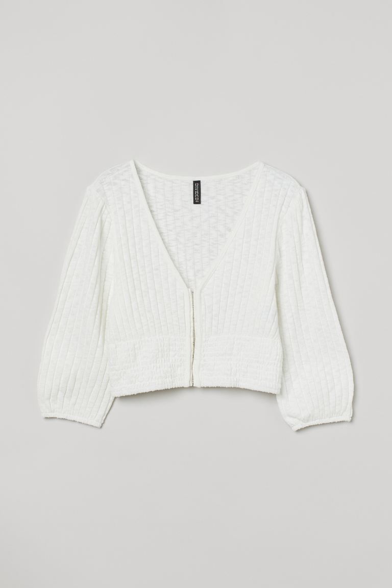 Crop top in airy, fine-knit fabric. V-neck, opening at front with hook-and-eye fasteners, and wid... | H&M (US)