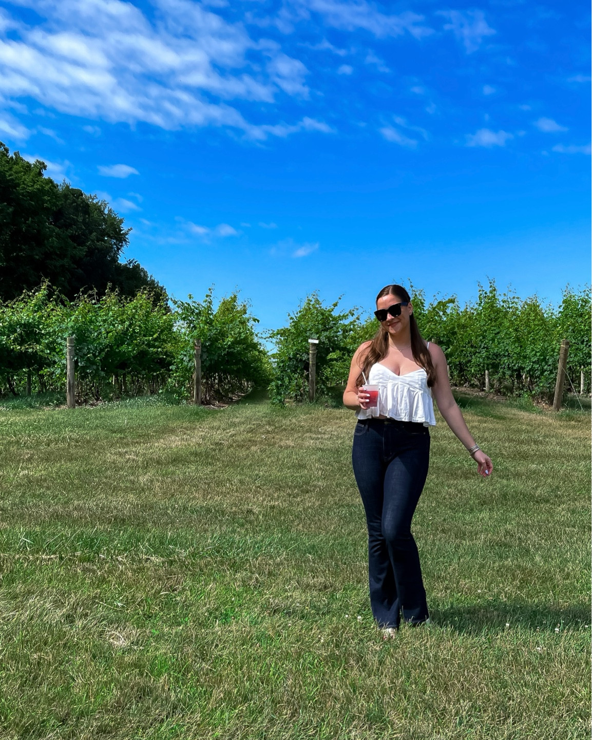 visit the moonrise winery in Michigan

free people set, j.crew jeans, white top, jack rogers, flared denim, winery, oversized sunglasses, cropped top, summer style 
