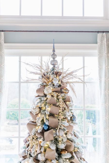 Silver tree topper on a taupe themed Christmas tree. Create the full look with gold seed spray, a jeweled tree skirt, gold ribbon and blue and gold Christmas ornaments.

#LTKSeasonal #LTKhome #LTKHoliday