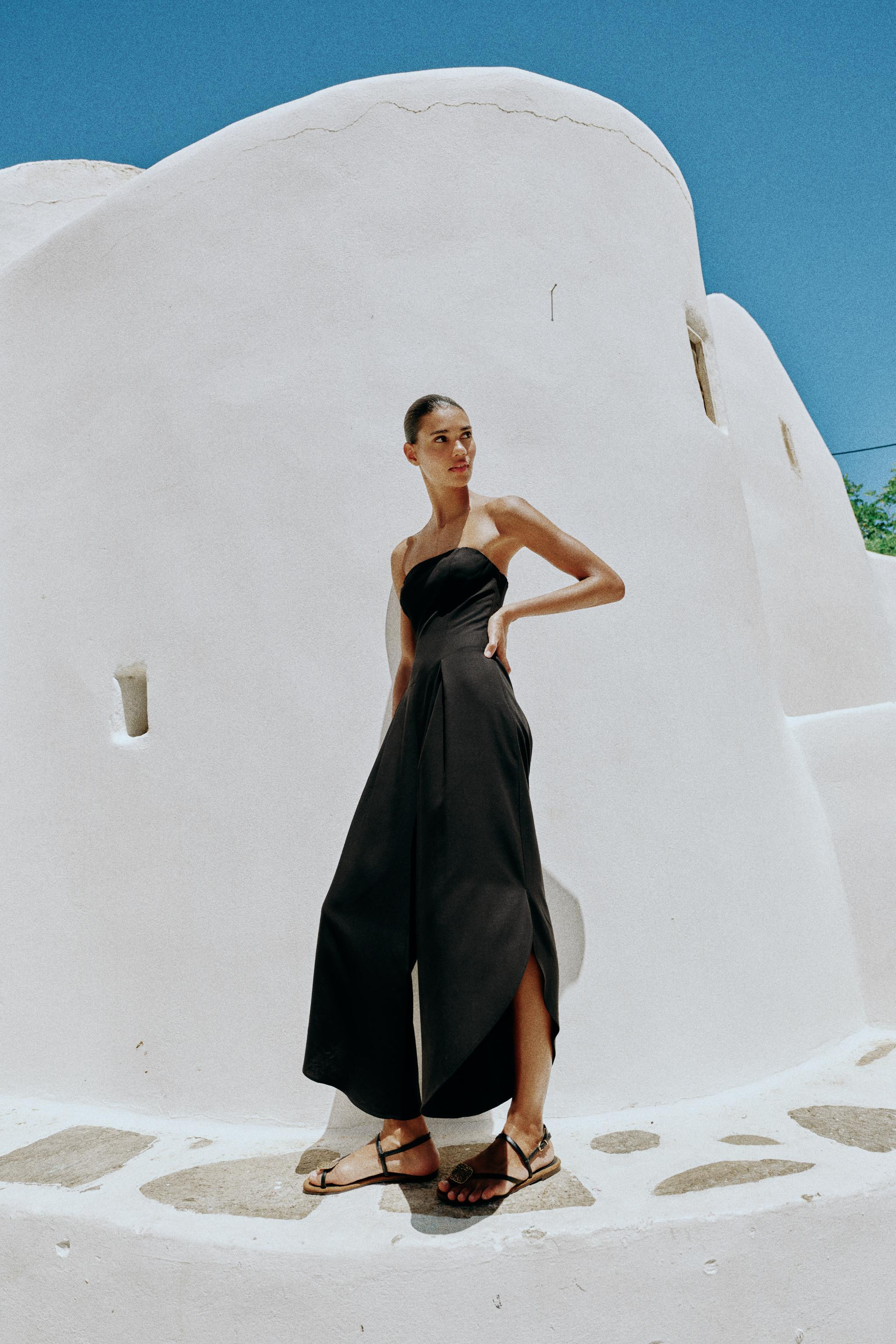 Midi strapless jumpsuit with straight neckline. Pleat detailing at the front. Very wide leg. Asym... | Zara US