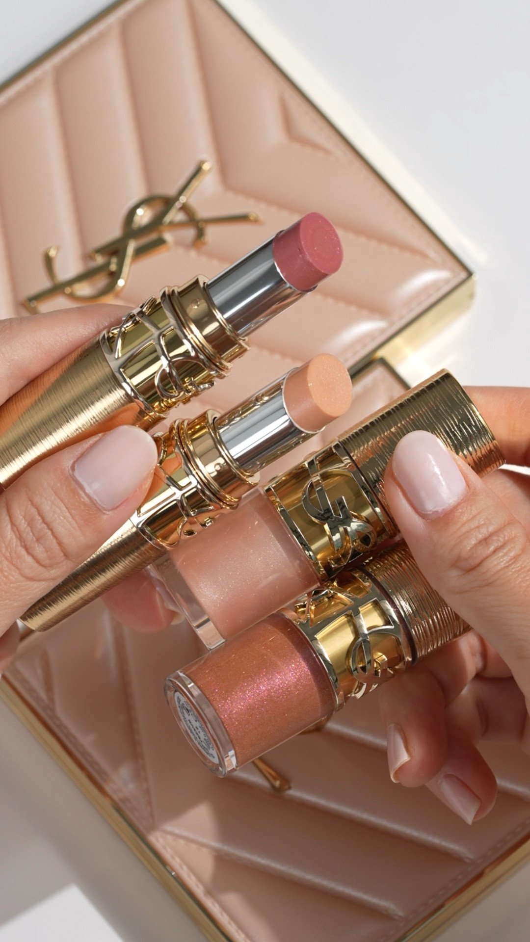 Glowy lip swatches with the YSL Beauty holiday lip colors. There are two new shades of the Candy Glaze Lip Gloss Stick and Loveshine Plumping Lip Oil.

Candy Glaze Lip Gloss Sticks are on the thicker, very creamy and hydrating, love this finish because it adheres well to the lips

21 Shimmer Nude is a very pale pink shimmer (like this one paired with a deeper liner)
22 Shimmer Rose is the prettiest rose gold pink

Loveshine Plumping Lip Oil is one of the most dramatic lip plumpers, I fell in love with the colors, but the formula is still 9/10 painful for me. Layering it on top of a lipstick makes them more tolerable, but if you can't do stinging lip products this is not for you!

100 Sparkling Dream is a champagne pearl
12 Honey Moon is a sparkling rose gold copper

Have you tried these yet? What did you think?

#yslbeauty #candyglaze #loveshine #swatches 

#LTKBeauty #LTKSeasonal