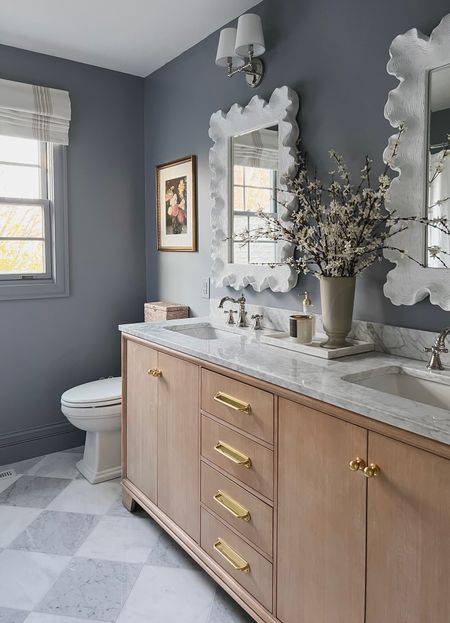 #ad This paint color I chose from HGTV Home by Sherwin Williams at @loweshomeimprovement was one of the most asked about elements of this bathroom design! It’s called “Let it Rain” and is such a pretty deep blue/gray tone. During Lowe's SpringFest sale Buy 2 Get 1 Free HGTV Home® by Sherwin-Williams paints and primers and Cabot® stains via Lowe’s gift card rebate 4/18 - 5/1. I always use Sherwin Williams paint because it covers so well—as you can see I didn’t have to prime, and did one coat in the room! I used satin on the walls, and semi gloss on the trim. #lowespartner I’m going to link the paint along with all of my go-to paint tools from Lowe’s that made this job quick and easy!

#LTKSeasonal #LTKhome #LTKsalealert
