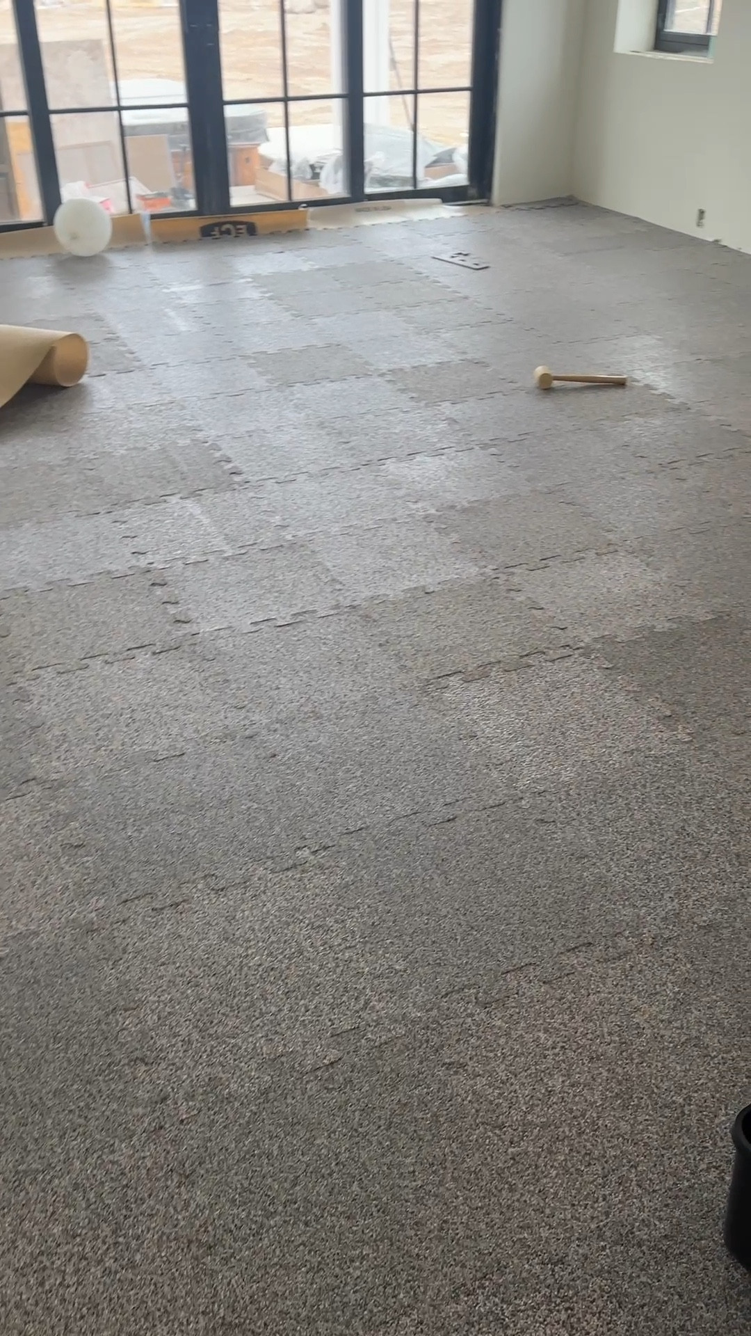 Gym flooring going in! Used a cork waterproof underlayment for cushion, heat, and waterproofing between it and the concrete  