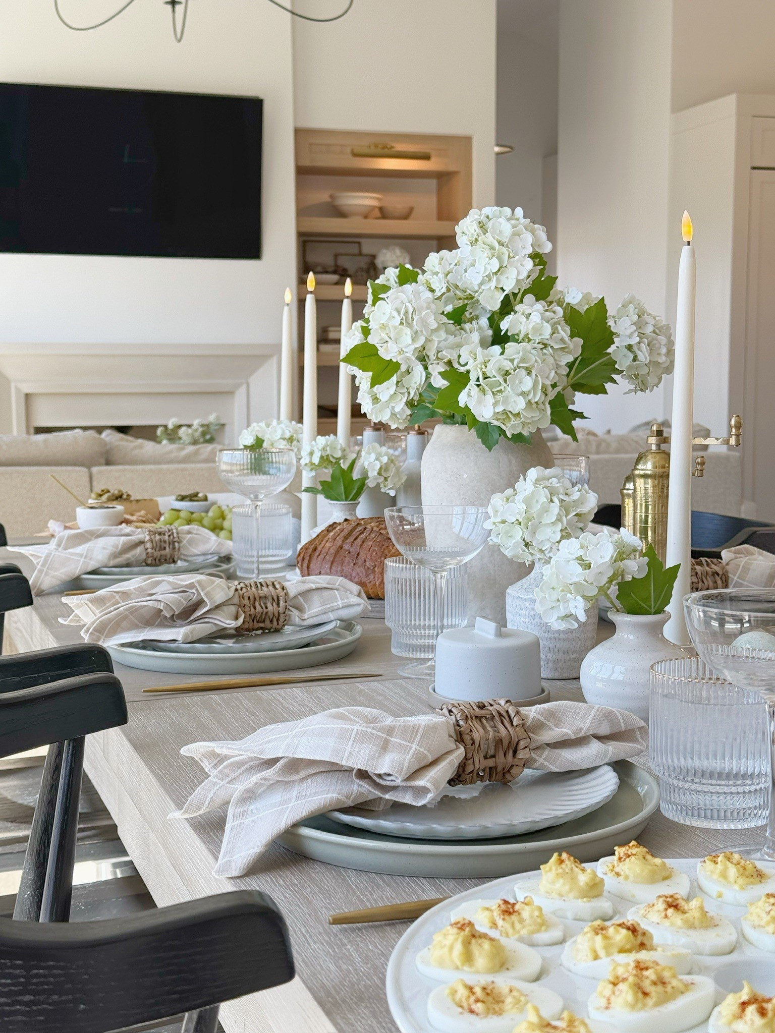 This Easter table feels fresh and effortless with soft plaid napkins, woven textures, and simple white florals! Just the right mix of cozy and classic for a spring gathering at home!

#LTKStyleTip #LTKHome #LTKSeasonal