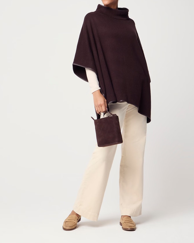 Faux leather trimmed poncho - in chocolate brown and black. The perfect layering piece for fall!

#LTKSeasonal #LTKSaleAlert