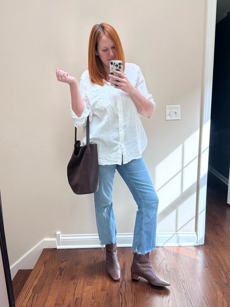 Everyday mom on the go spring outfit - gauze button down, light wash jeans, bucket bag, and booties 