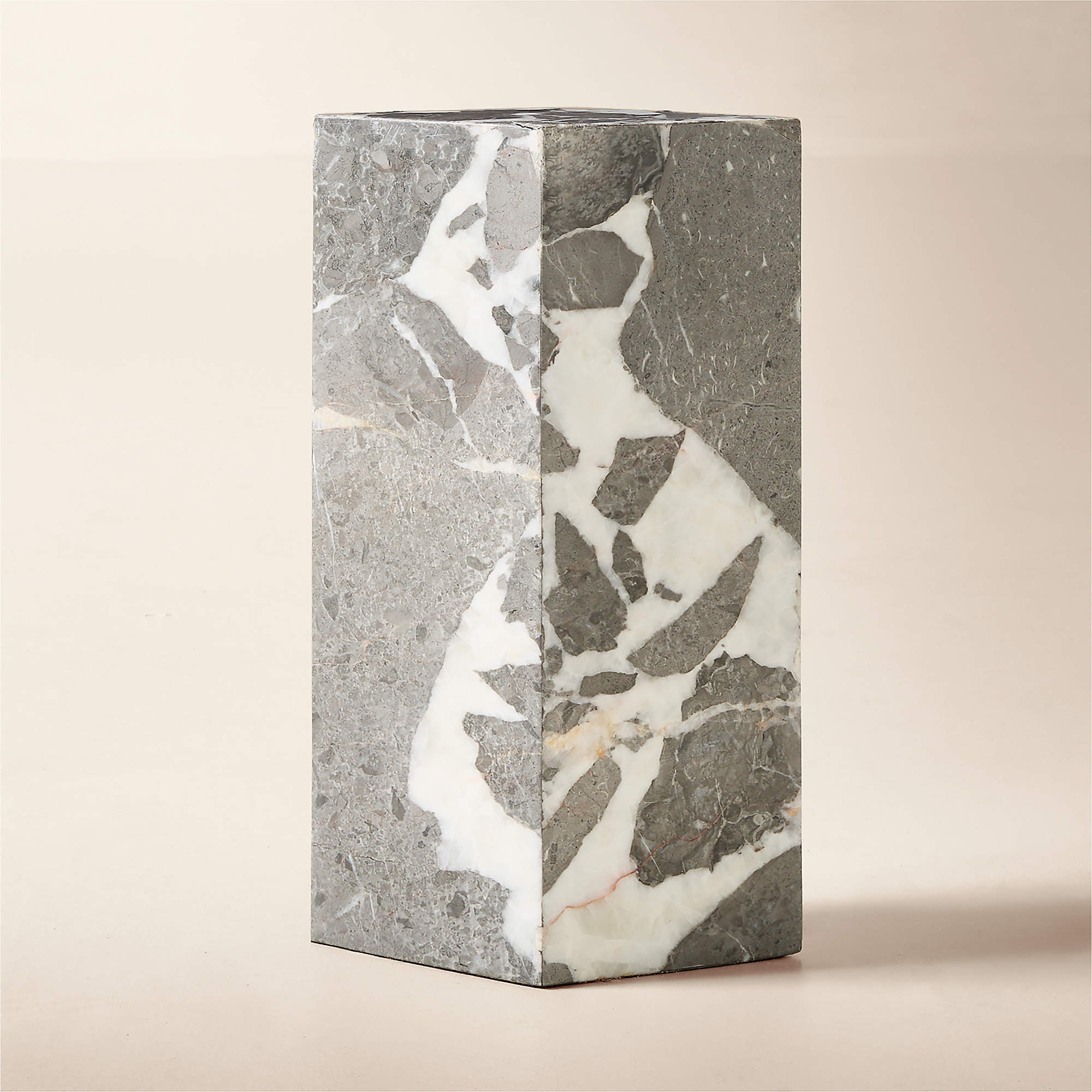 Ross Cassidy cut a drink table into a diamond and let the marble do the rest. Honed grey with pink veining you only notice up close. Small enough to pull next to a club chair, sculpted enough to hold its own when nothing's on it.
Glam, in miniature.
#RossCassidy #CB2 #MarbleTable #DrinkTable #AD100Designer #SideTable #InteriorDesign #ModernGlam #SculpturalFurniture #HomeDecor 

 #LTKHome