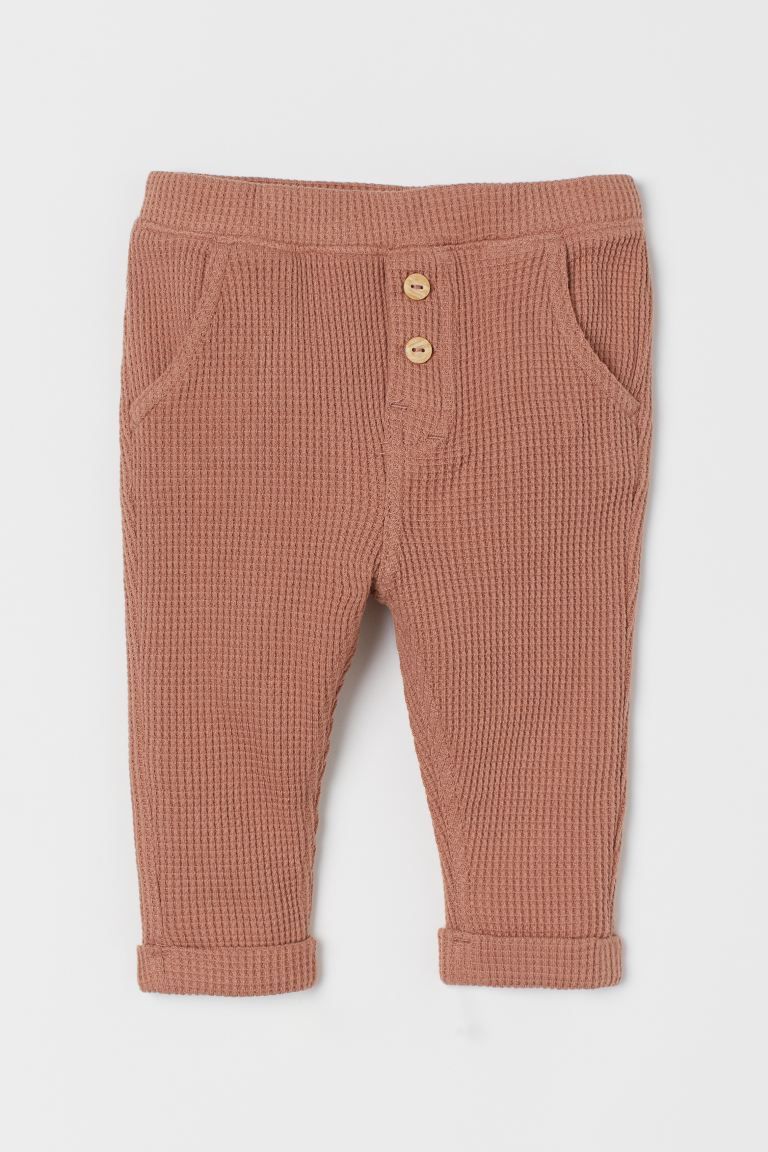 Baby Exclusive. Pants in soft, waffled, organic cotton jersey. Covered elasticized waistband with... | H&M (US + CA)