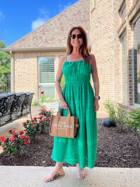 The prettiest grass green midi dress in an eyelet material. It has a smocked waist that's figure-flattering. I'm wearing size XS here, but actually exchanged for a Small for a little more room in the bust area. I paired it with my Marc Jacobs small jacquard tote and a pair of strappy slides.
#midlifestyle #resortwear #summeroutfit #vacationlook

#LTKstyletip #LTKSeasonal #LTKshoecrush