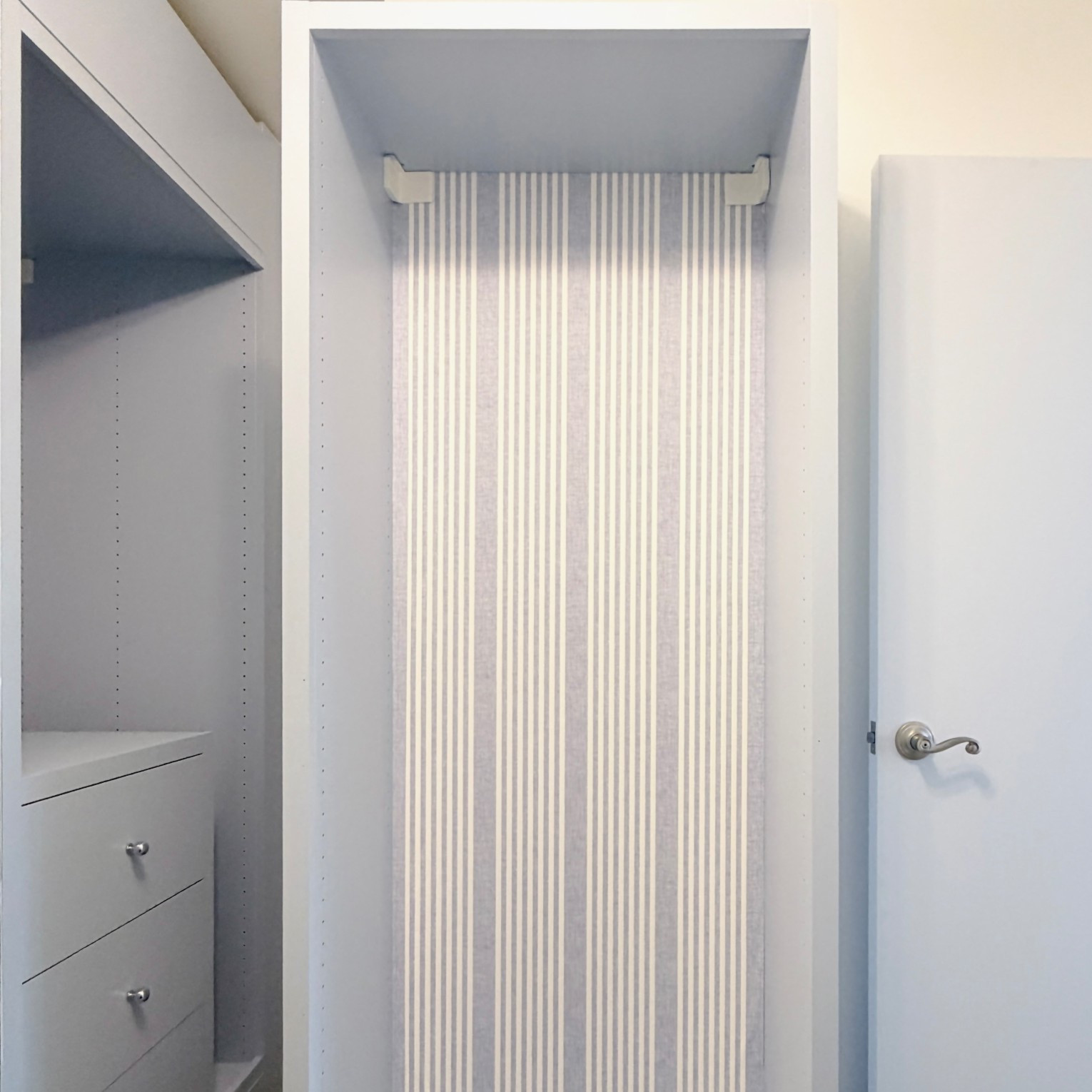Just installed the prettiest blue linen striped wallpaper on the back of my ikea pax wardrobes to hide the seam on the back & it looks so pretty, polished & high end. The install was easier than expected too. It comes pre pasted, so all you have to do is spray it with water to activate the glue & hang it. I found it was very forgiving. 

#LTKHome
