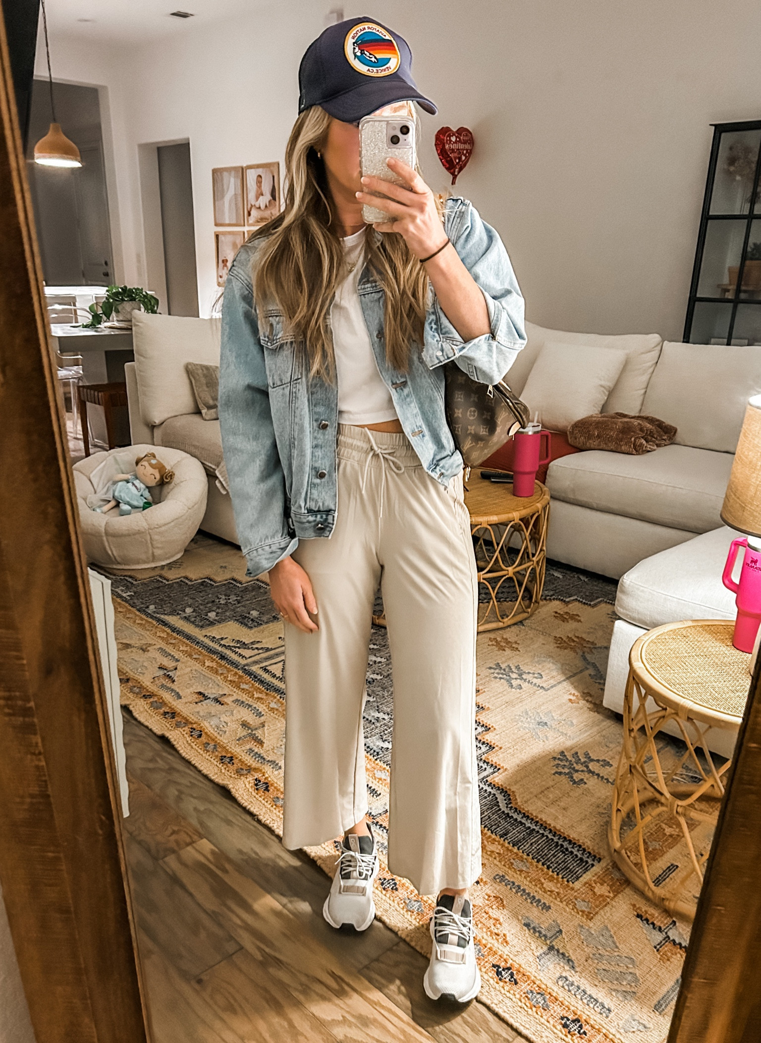 travel outfit - wide leg pants that don’t wrinkle, jean jacket (goes with everything in case it gets cold) cropped white tee, and cloud nova sneakers (linked all!) trucker hat. LV Bum Bag

#LTKtravel #LTKstyletip #LTKsalealert