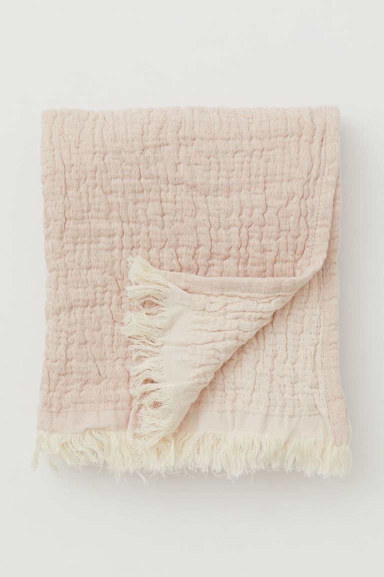 Conscious choice  BabyThrow in soft, woven cotton fabric with fringe at short sides.Weight370 gCo... | H&M (US + CA)