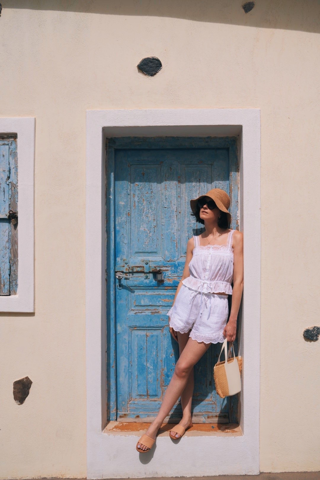 soaking up the sun in Santorini 🌞🇬🇷🕶️ I’m so happy I brought this raffia bucket hat - it’s been a life saver for protecting my face from the sun & it’s a cute outfit accessory too! Also these sandals from Fitory are so comfy & very well priced - under $50!