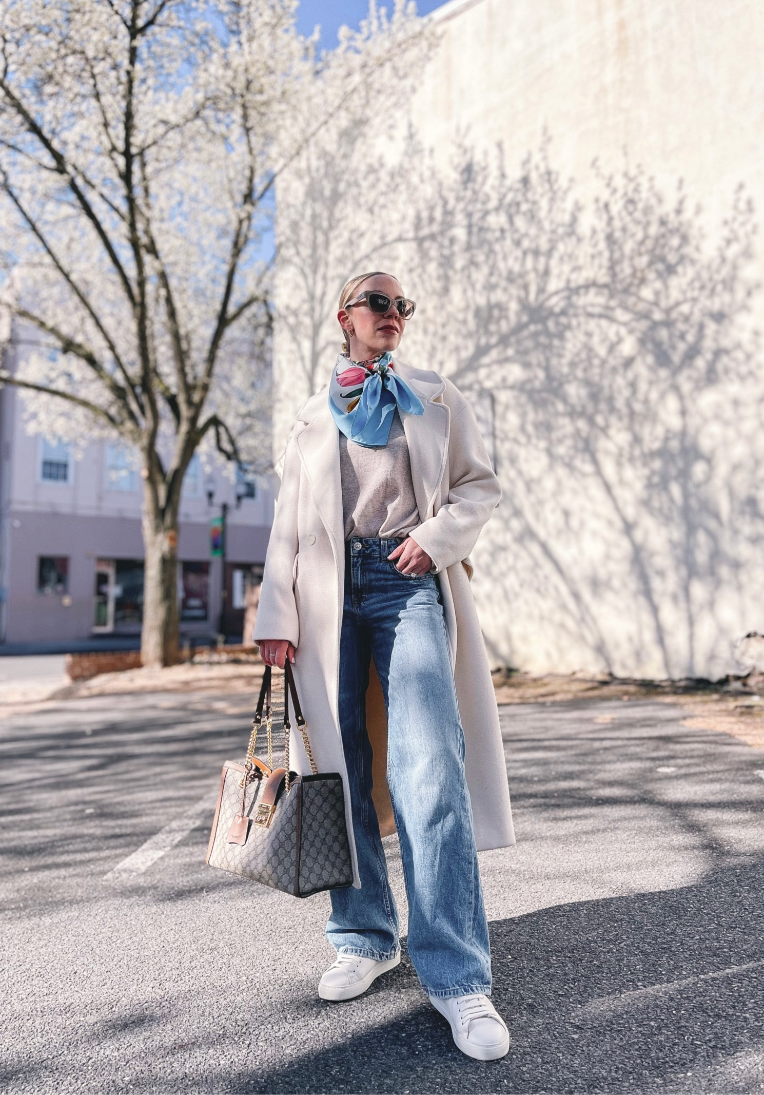 Spring outfit idea, wide leg jeans, white sneakers, cream coat, Gucci silk scarf, classic style 

#LTKSeasonal #LTKstyletip #LTKshoecrush
