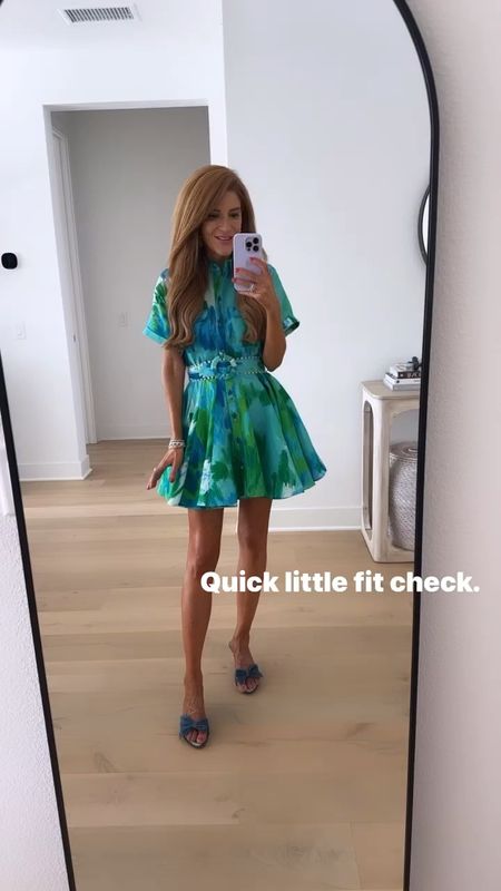 Love this bright belted mini dress for Spring parties/vacation. The blue + green are so happy! Wearing it with these denim mules I adore- mini heel, cutest little bow. Wearing XS in the dress, sandals run TTS 

#LTKover40 #LTKshoecrush #LTKSeasonal
