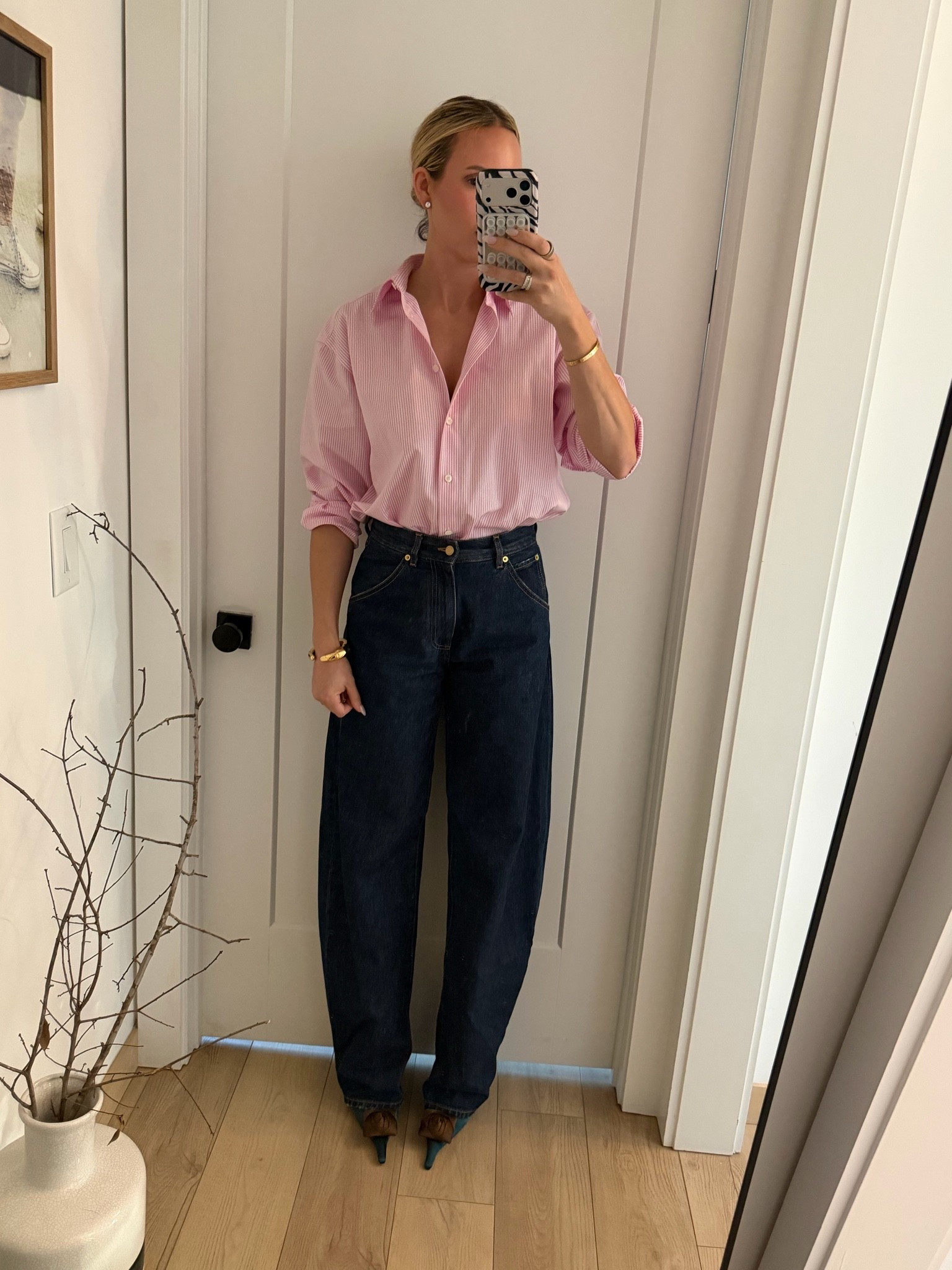 I’m wearing a medium in the button-down. It’s already very oversized. Jeans run tts and are very tall girl friendly! I’m 5’10. Heels are Saint Laurent dupes ￼￼

#LTKOver40 #LTKootd #LTKTall