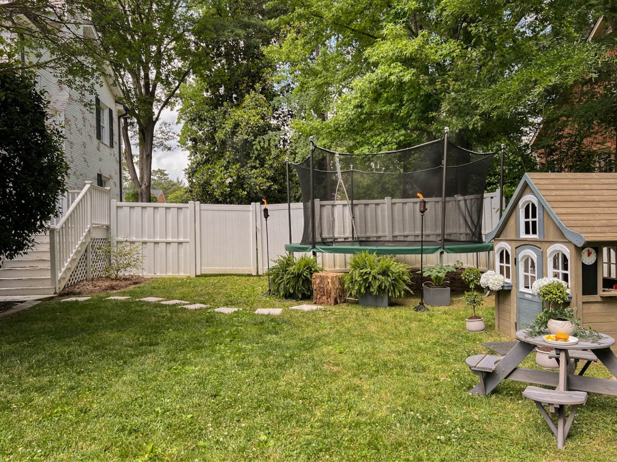 The kids’ space with their trampoline, playhouse, and swing set!  

#LTKhome #LTKkids #LTKfamily