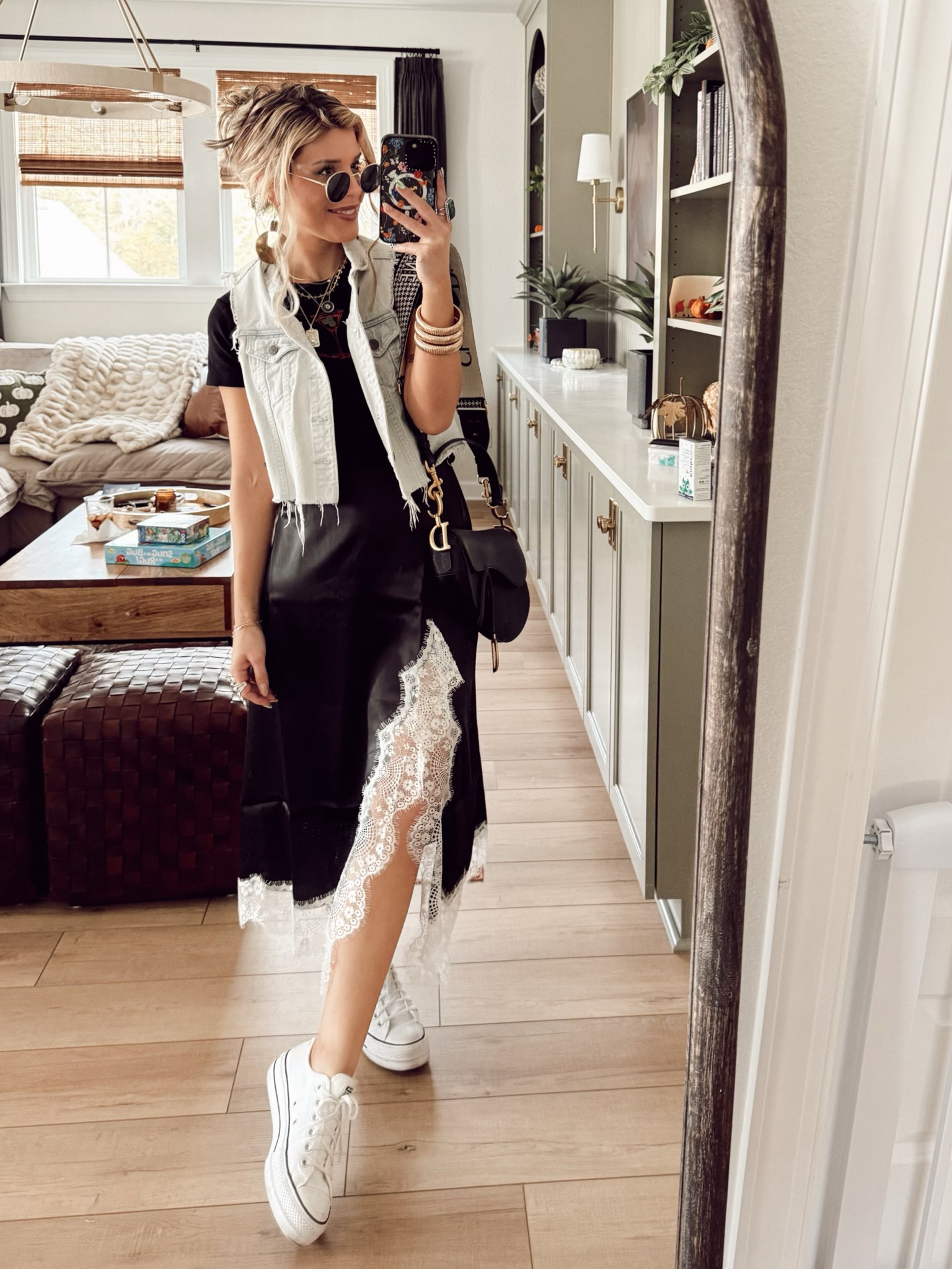 Baby T- small boutique 
Skirt- Dressed in Lala 
Sneakers- Converse 
Vest- old Show Me Your Mumu
Bangles- Revolve 
Earrings- Twisted Silver 
Sunnies- Amazon 
Purse- Dior 

#LTKStyleTip