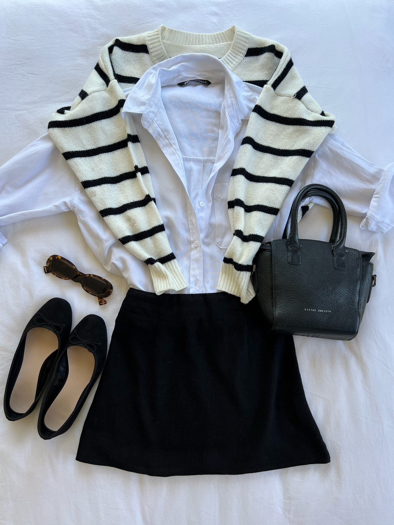 casual city chic outfit idea - Zara white button up, shein stripped jumper, black mini skirt, ballet flats 