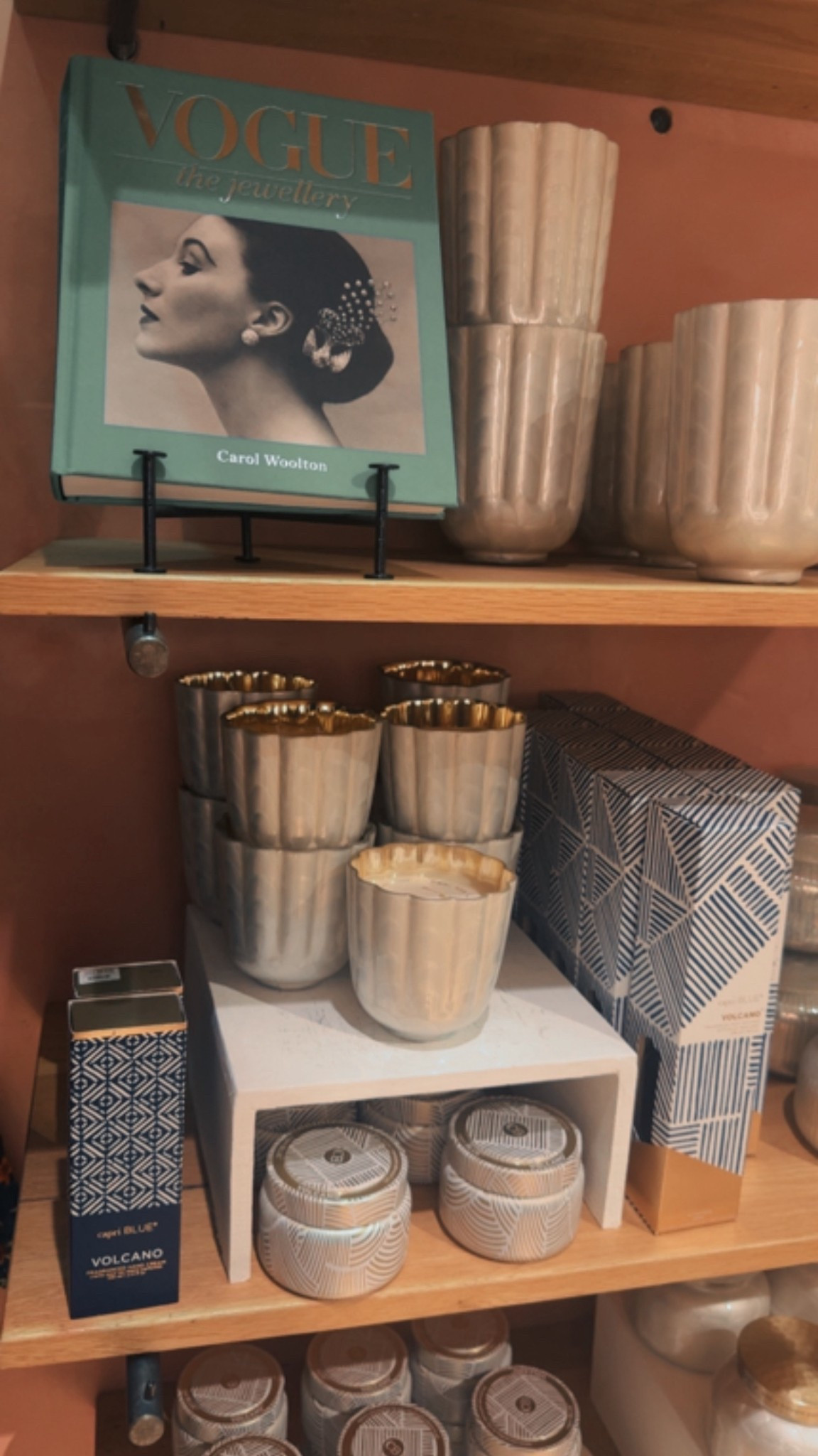 Coffee table book find from Anthropologie! 🩵 // Vogue book, Capri Blue scalloped candle 

#LTKHome #LTKSeasonal