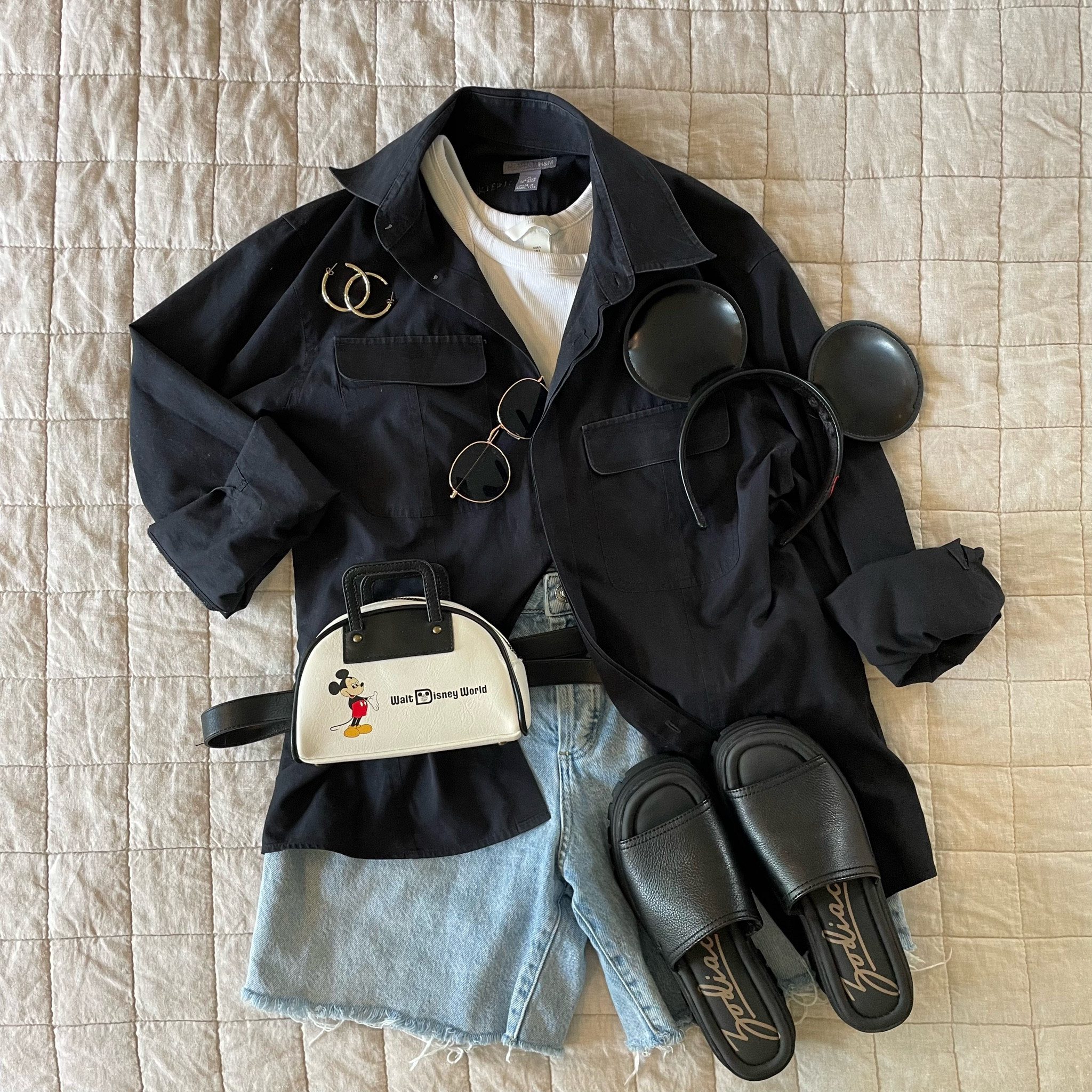 Classic Mickey style for Disney World or Disneyland. Styling my new zodiac slides. This outfit is perfect for any park and emulates the classic it girl goes to Disney look. Paired with simple black leather Mickey ears, vault collection Fanny pack, and gold accessories! #disneystyle #disneyitgirl #subltedisneystyle #disneyoutfits 

#LTKtravel #LTKfit #LTKsalealert