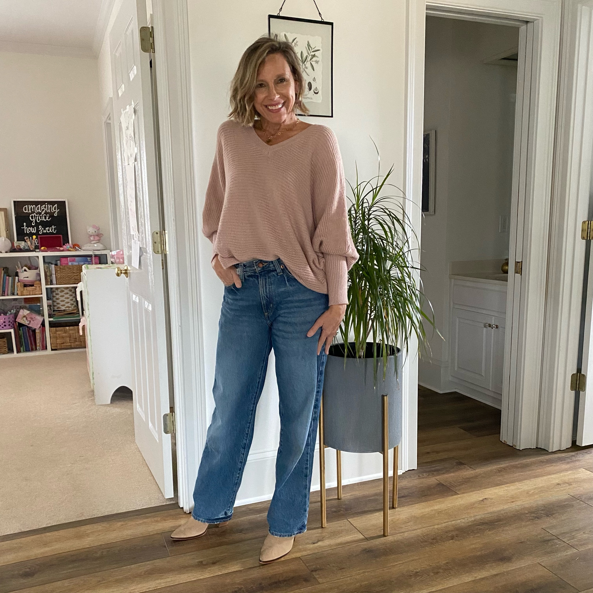 Cute and casual outfit. The jeans run large. They are a baggy fit. I’m normally a size 4 but found that a 2 fit best. The sweater is such a pretty color of rosy pink. Love the sleeves!

#LTKstyletip #LTKworkwear #LTKfindsunder50