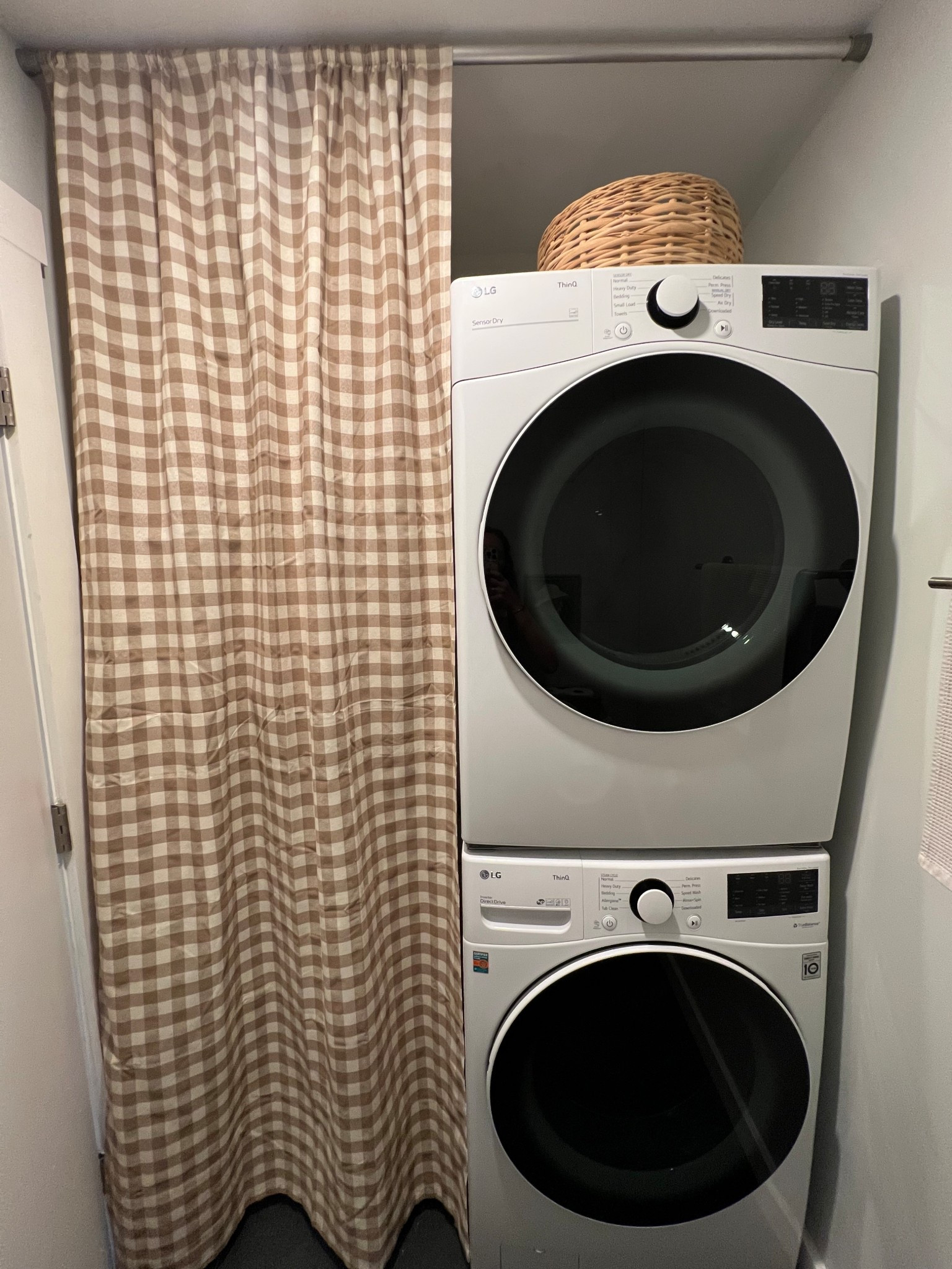 Cutie gingham curtain hiding ugly electrical 👍🏻 I just used a tension rod to hang it! Easy peasy! 

They have lots of colors for the curtain panel, I have “taupe” 
