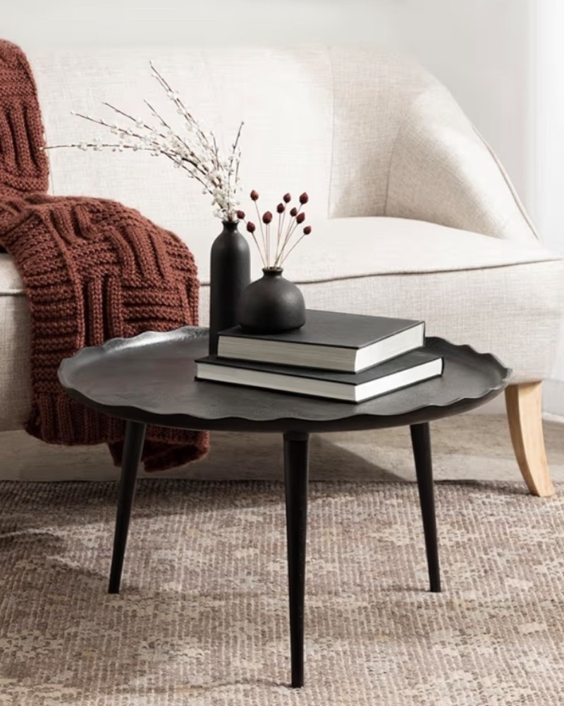 Black metal coffee table with that moody modern sculptural look that instantly makes a living room feel more elevated. ✨ Perfect for a sofa setup, apartment living room, cozy sitting area, office lounge, or dark modern home aesthetic when you want something simple but still statement-making. The round shape, sand cast aluminum finish, and raised deckled edge make it perfect for styling books, candles, trays, florals, or everyday essentials. 

Add this coffee table if your space needs a sleek centerpiece with a little edge and a lot of designer energy. 🖤

#LTKSeasonal #LTKHome #LTKU