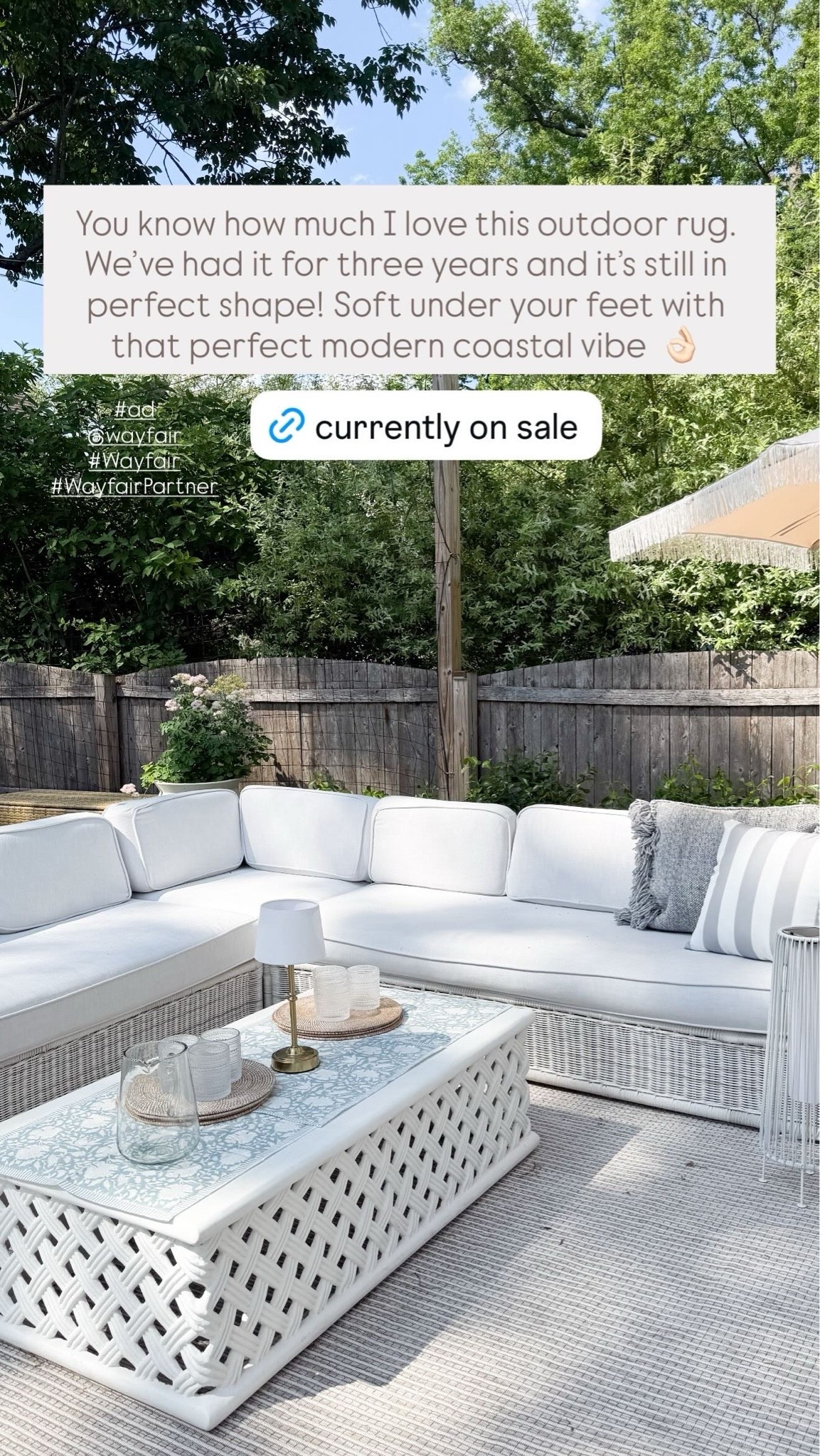 #ad We're ready for outdoor entertaining this season all thanks to @Wayfair! 

Our outdoor rugs have lasted years (and still look gorgeous!!) -- perfect for that perfect modern coastal look. I also found the prettiest throw pillows for our sofas and rocking chairs, a woven storage box that blends seamlessly with our decor (for all of the kids' toys), an umbrella that will make you feel like you're on vacation, and outdoor solar lights that let you entertain when the sun goes down.

#LTKSaleAlert #LTKHome #LTKSeasonal