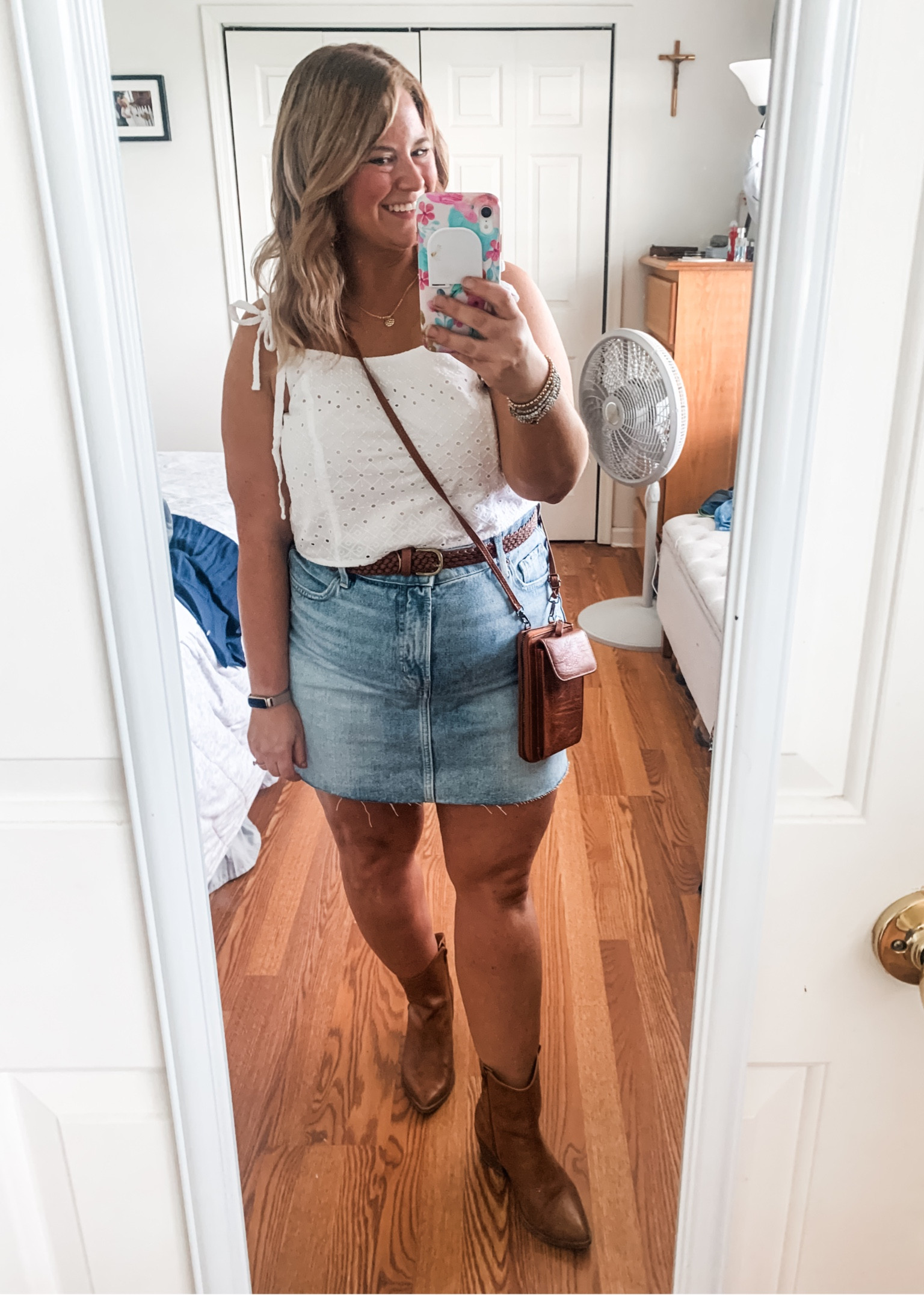 Country concert outfit
 Eyelet crop top
Denim skirt
Western boots 