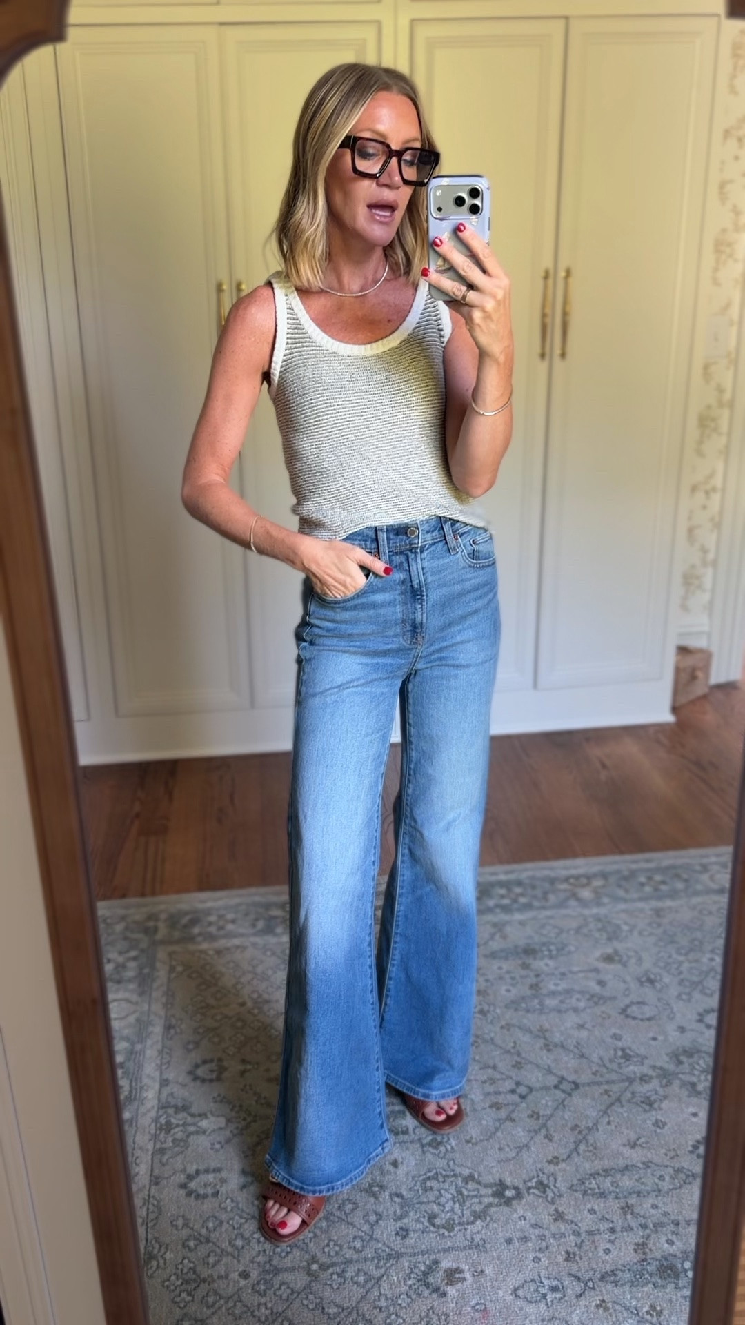 Side UP one in these jeans for a more relaxed fit. This is the 4 regular length and I am 5 7 for reference. Wearing Xs in the sweater tank