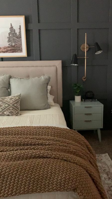 Master bedroom with upholstered bed, accent lighting, wall art, faux tree, bedding, and more! 

#LTKhome #LTKSeasonal #LTKunder100