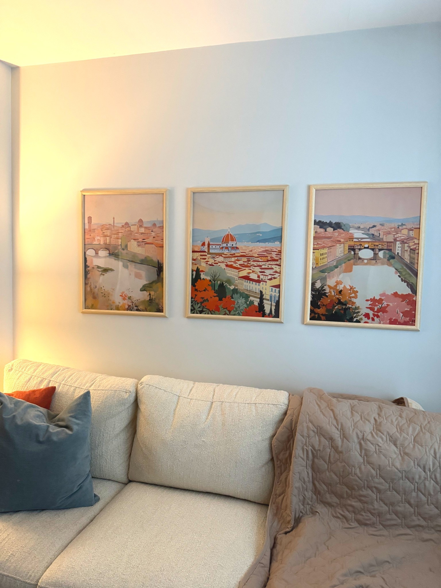 I finally found artwork that works with our cream, orange, and blue living room. These Florence prints are incredible quality! Ps. This pet blanket is the BEST way to keep dog hair off your couch while still letting your pets on the couch. 

#LTKHome