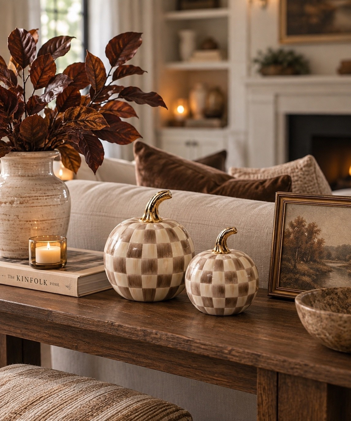 A little pattern goes a long way for fall. 🤎 These mocha check pumpkins bring just enough seasonal charm while still feeling elevated and neutral, especially paired with rich brown fall stems, warm wood tones and vintage-inspired art. I love this kind of fall decor because it adds personality to a living room without taking over the entire space—and the gold stems are such a pretty finishing detail.

checkered pumpkins, mocha check pumpkins, fall pumpkin decor, neutral pumpkin decor, brown pumpkin decor, ceramic pumpkins, decorative pumpkins, fall home decor, neutral fall decor, brown fall decor, elevated fall decor, elegant fall decor, cozy fall decor, Amazon fall decor, Amazon fall finds, Amazon home finds, fall living room decor, fall living room ideas, console table decor, fall console table decor, sofa table decor, fall vignette, fall styling ideas, autumn home decor, subtle fall decor, sophisticated fall decor, designer inspired decor, warm neutral decor, brown home decor, neutral home decor, traditional home decor, transitional home decor, collected home decor, vintage inspired decor, gold accents, fall stems, brown fall stems, faux fall branches, ceramic vase, vintage landscape art, warm wood decor, cozy home inspiration, fall decorating ideas, autumn decorating ideas, seasonal home decor, neutral autumn decor, warm fall aesthetic, luxury fall decor, timeless fall decor, cozy neutral home

#LTKHome #LTKSaleAlert #LTKSeasonal
