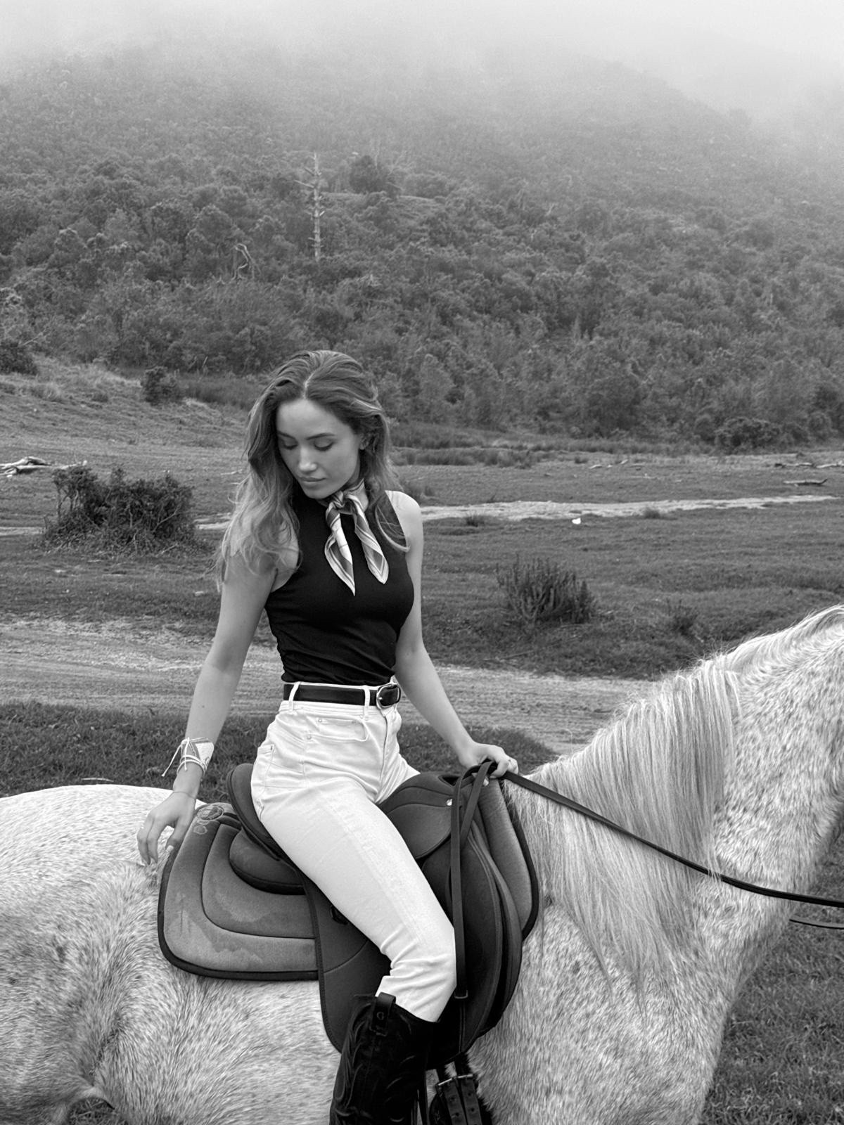 Riding days out🐎 wearing a black tank top, white denim, black cowboy boots and a little silk scarf for the extra touch

#LTKspring