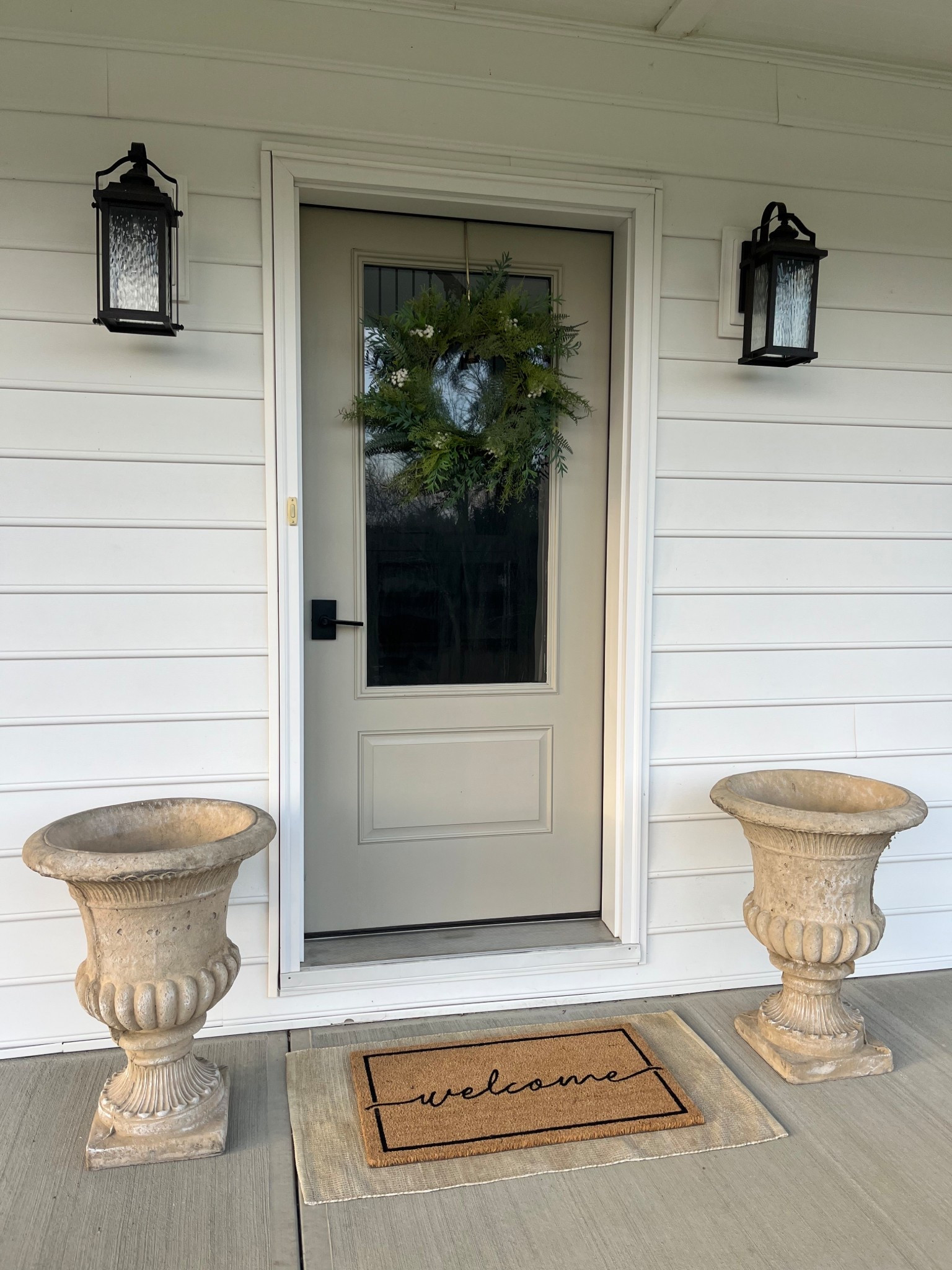 #ad #lowespartner @loweshomeimprovement can’t believe these pretty outdoor finds from Lowe’s! the concrete urn planters have the perfect amount of charm and character. I love the script on the doormat and it’s under $30. This is the second year using this spring wreath & it’s holding up great!

#LTKSeasonal #LTKHome