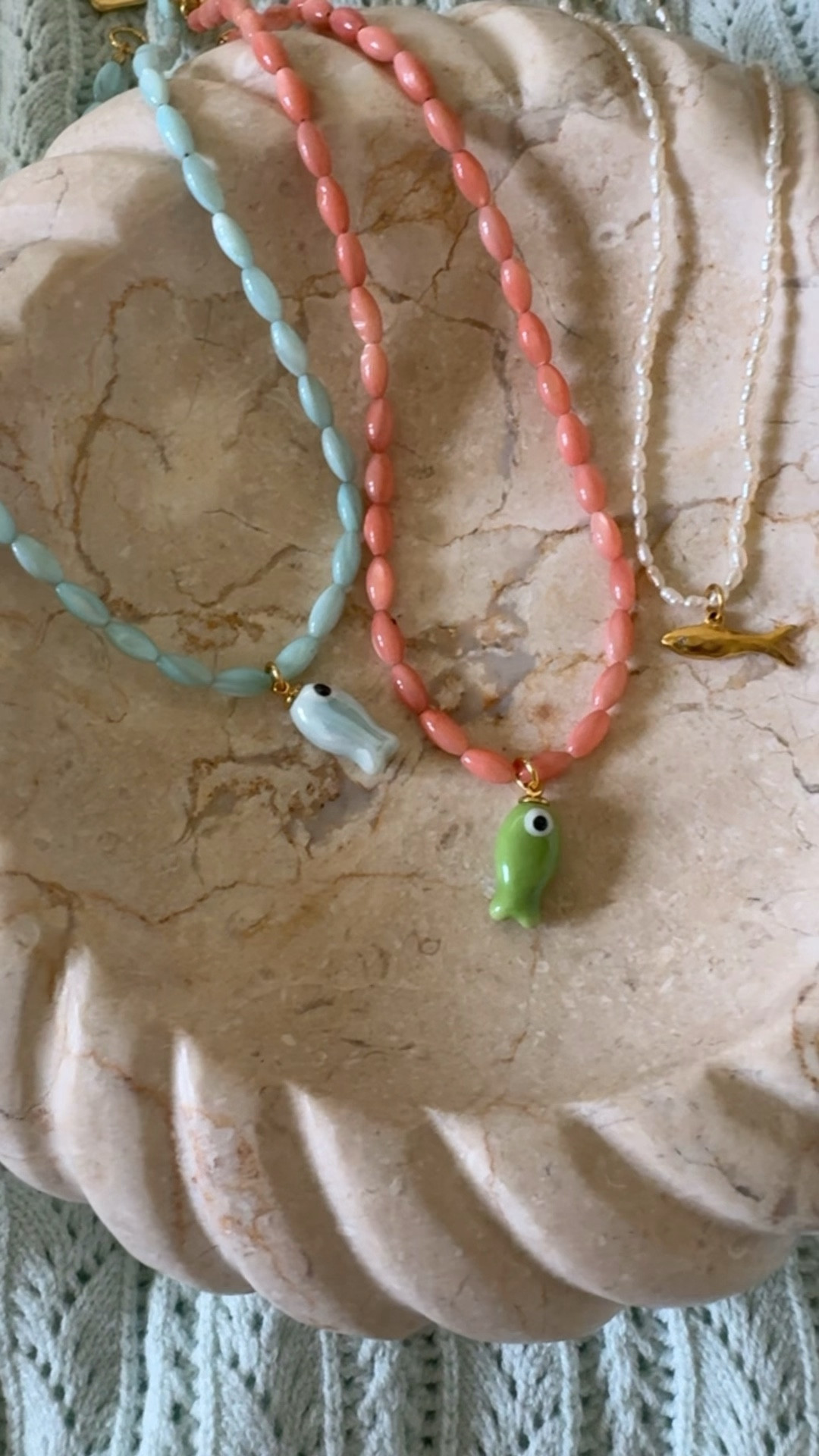 Summer necklaces. Fish bead necklaces. 
Gold fish necklace is 20% off. 

#LTKSeasonal #LTKOver40 #LTKSaleAlert