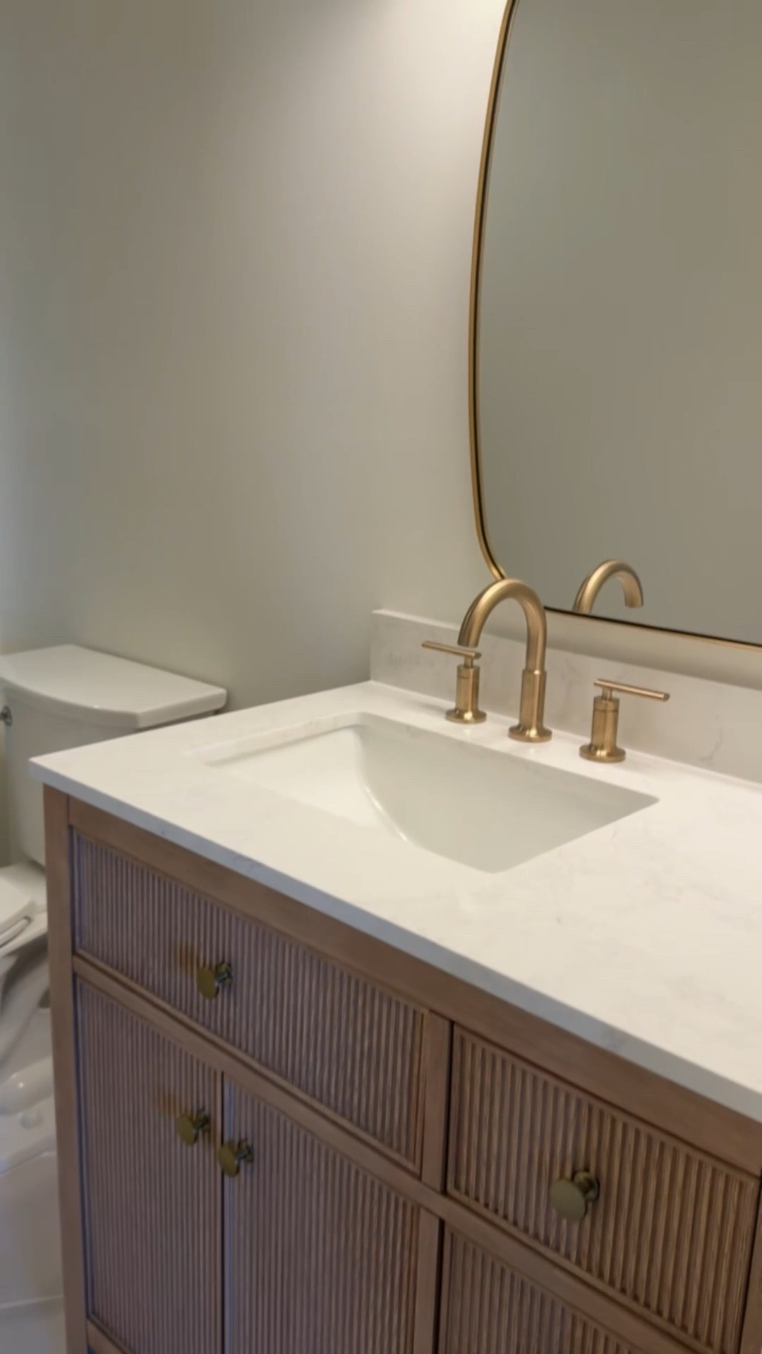 Bathroom remodel with a fluted neutral vanity 💕

#LTKHome #LTKSaleAlert