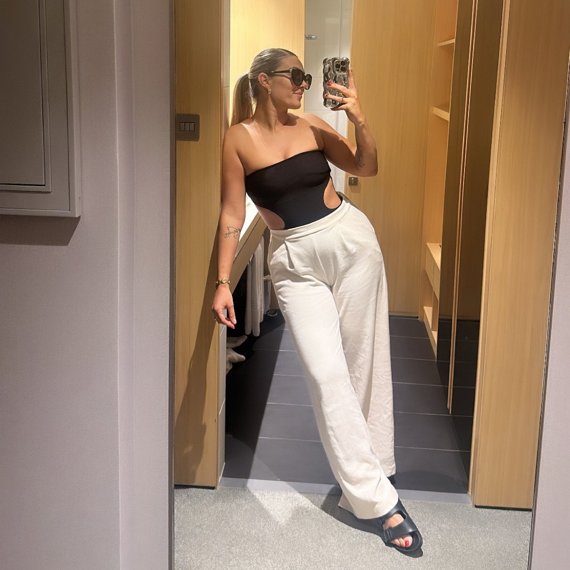 Wearing a black bandeau cut out swimsuit as a top with white textured jersey trousers and Birkenstocks for a pool day! ☀️ 

Wearing size 12 in the trousers

#LTKtravel #LTKHoliday #LTKswim