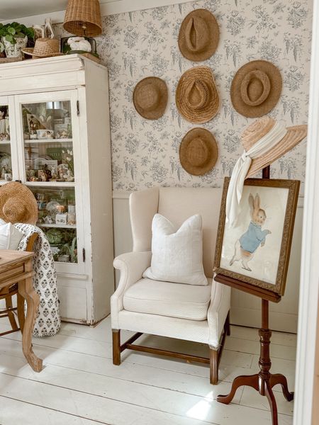 Cozy corner with a thrifted hat gallery wall 🫶🏼🫶🏼🫶🏼 see more on my instagram: @lizmariegalvan 

#LTKSeasonal #LTKhome