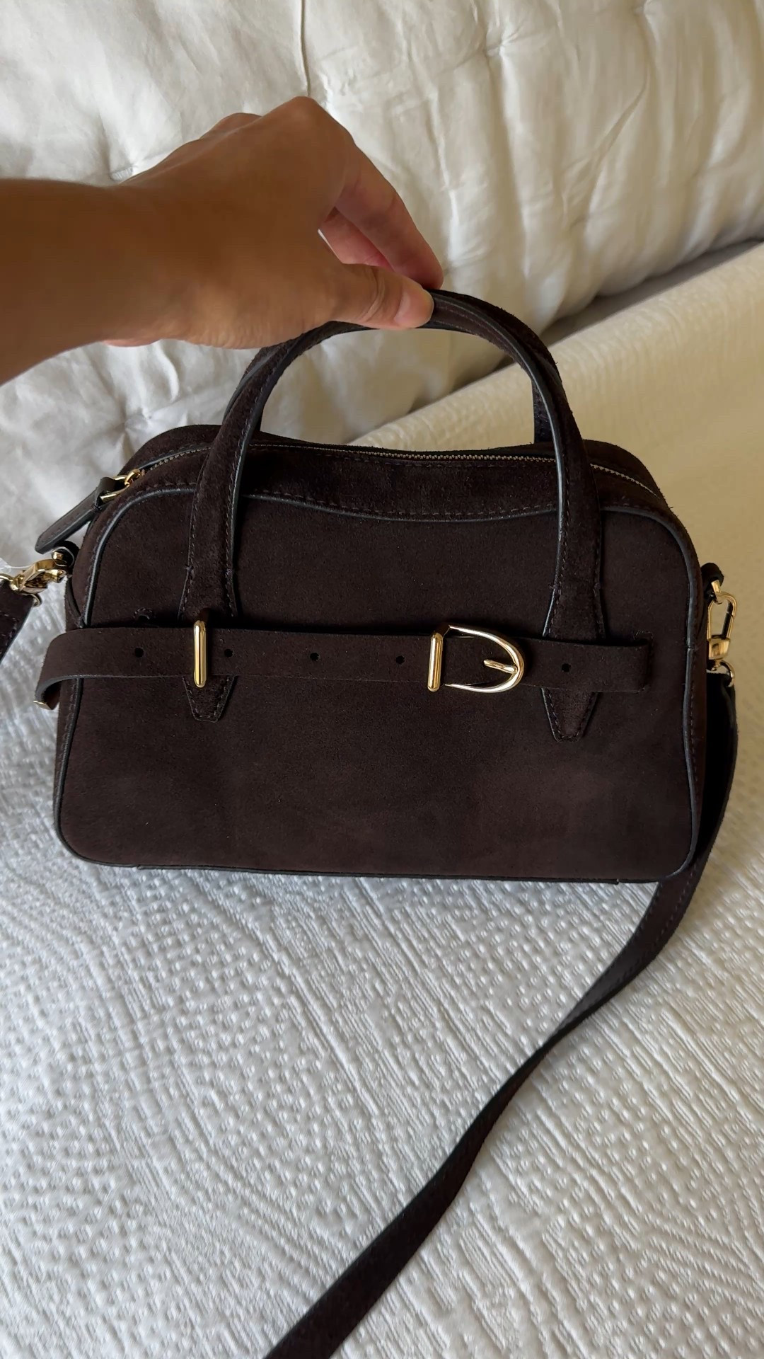 Beautiful suede bag!  Can be worn as a crossbody or handheld. The color is a deep dark brown, that’s almost black. 
Good small bag size for essentials. Slit pocket inside. 
I ended up keeping the long top handle shoulder bag I shared recently only because it worked better for my daily casual outfits. 


#LTKItBag #LTKStyleTip #LTKOver40