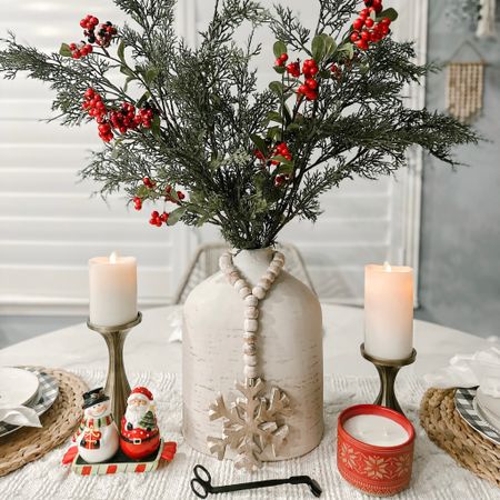 My fave centerpiece this year was so simple had this vase then had the berries added cedar branches 2 from target and one I had from target last year love it 

#christmas #christmascenterpiece #christmascandle #christmasarrangement 

#LTKSeasonal #LTKHoliday #LTKhome