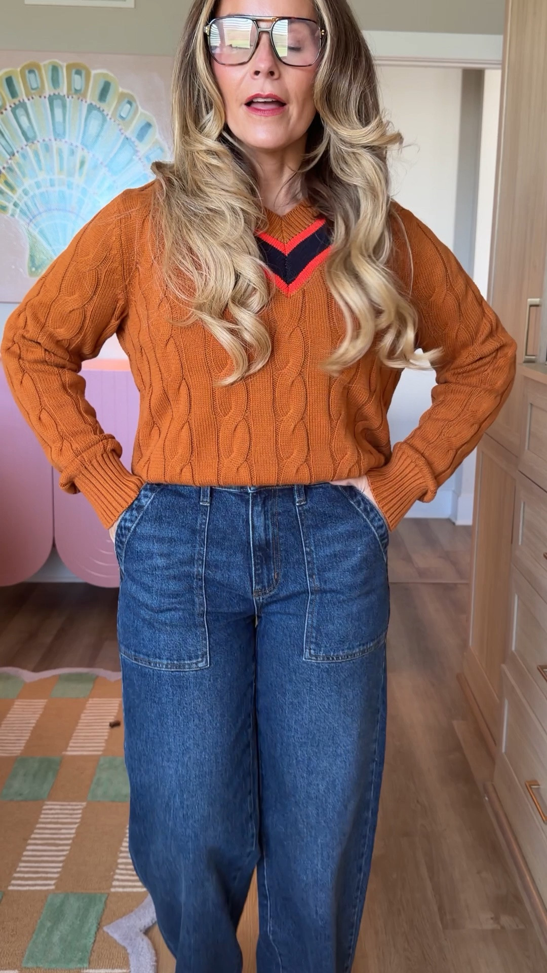 Petite girls, these are the ones. I'm 5'2" and these Walmart wide-leg jeans hit right where I want them with a little heel, no hemming needed 🙌 Paired them with a varsity cable knit and my suede tote for the easiest fall uniform. Wearing a size [4]. Everything's linked on my LTK 🤎