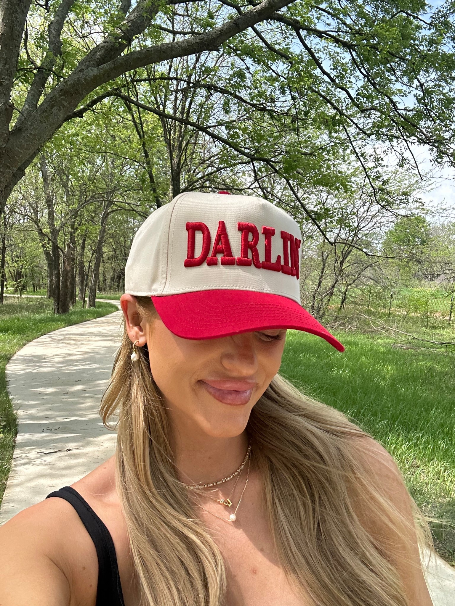 This “Darlin’” trucker hat is giving all the cute, casual vibes and I’m fully here for it! I’ve been loving easy accessories that instantly pull a look together, and this bold red and white hat from Amazon is such a fun statement. It’s perfect for sunny spring walks, messy hair days, or just adding a little Southern charm to your outfit. The fit is adjustable and super comfortable.

I paired it with a simple black tank for an easy on-the-go look, but it also looks adorable with denim shorts, graphic tees, or a comfy set for travel days. Available in a few different sayings/colors—definitely a must-add to your summer accessories lineup!

#amazonfashion #truckerhat #springstyle #casualmomstyle #southernstyle #amazonaccessories #darlinhat #ltkmom #ltkaccessories #easyoutfitidea

#LTKStyleTip