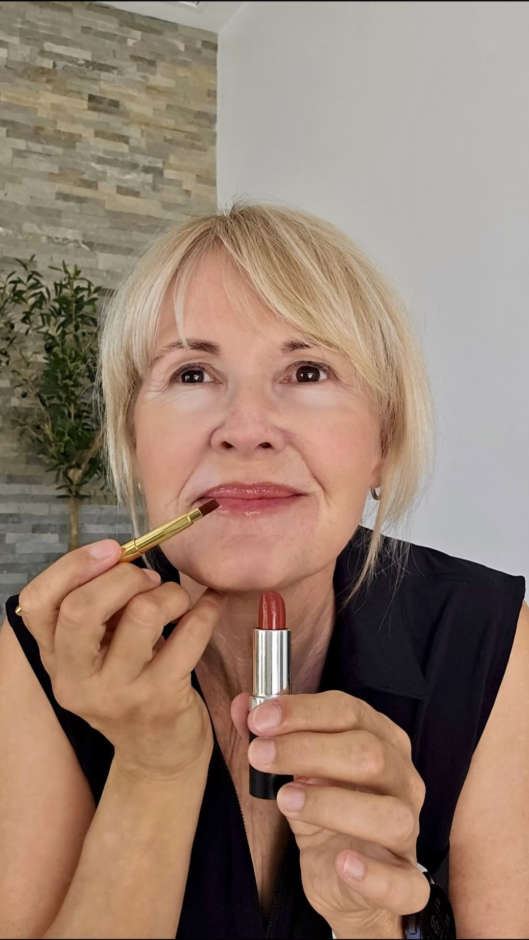 Putting on lipstick with just my selfie camera for a mirror — and  not wearing my glasses, lol. I always start with very moisturized lips (Aquaphor  works really well), and then I outline with a lip pencil (close to my natural lip color). I like using this retractable lip brush, which is sleek and handy for travel. And my lovely lipstick is full of nourishing ingredients (including jojoba seed oil and aloe). I have it in the shade “walnut."

#LTKOver40 #LTKBeauty