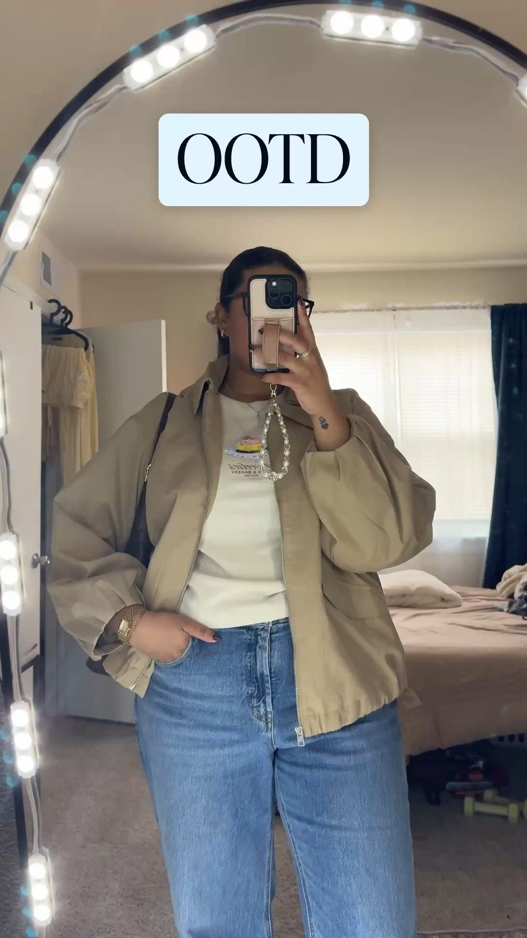 Lightweight tan jacket layered over a graphic tee with straight-leg jeans and classic black ballet flats. The perfect everyday casual look for coffee runs, errands, or weekend plans.

#springoutfit #neutralstyle #everydaylook #casualchic #balletflats #straightlegjeans 

#LTKvlog #LTKootd #LTKspring