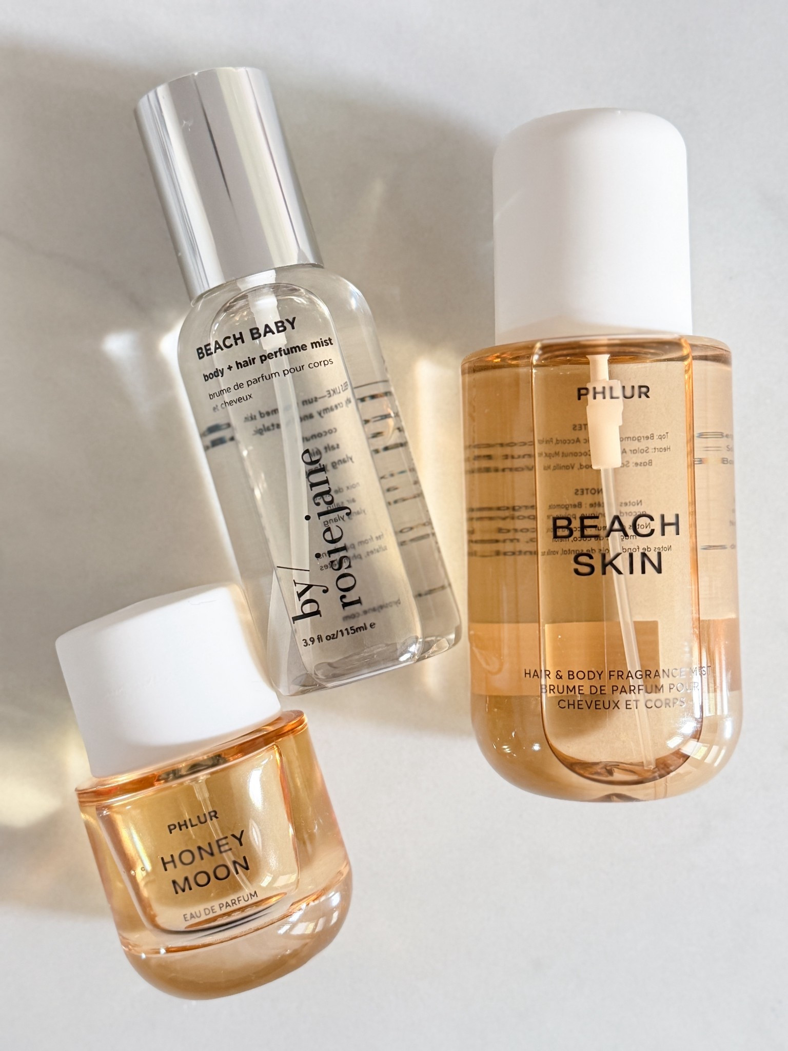 Summer scent must haves lately. These are the ones I keep reaching for when I want that clean, warm, beachy summer feel without anything too heavy. Easy for layering, easy to throw in your bag, & all so good for everyday.

summer scent must haves - beachy perfume - clean girl fragrance - warm weather perfume - perfume layering - body mist favorites - hair perfume - rosie jane beach baby - phlur beach skin - phlur honey moon - summer beauty favorites - everyday fragrance

#LTKgrwm #LTKBeauty #LTKMothersDay