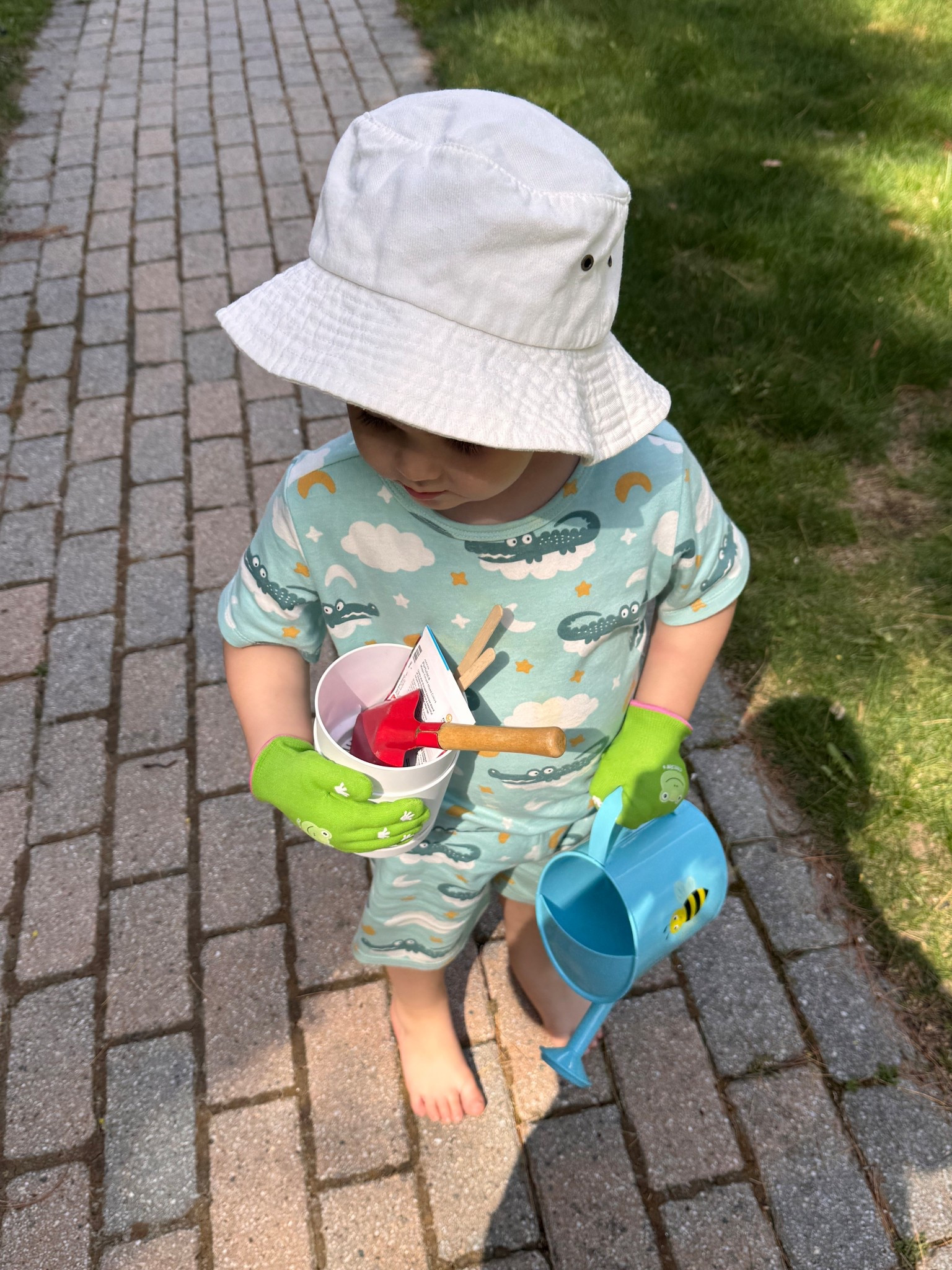 PJs and plants 🌱🌱🌱🌱🌱 these little toddler gardening gloves were such a good find by the Easter bunny! 