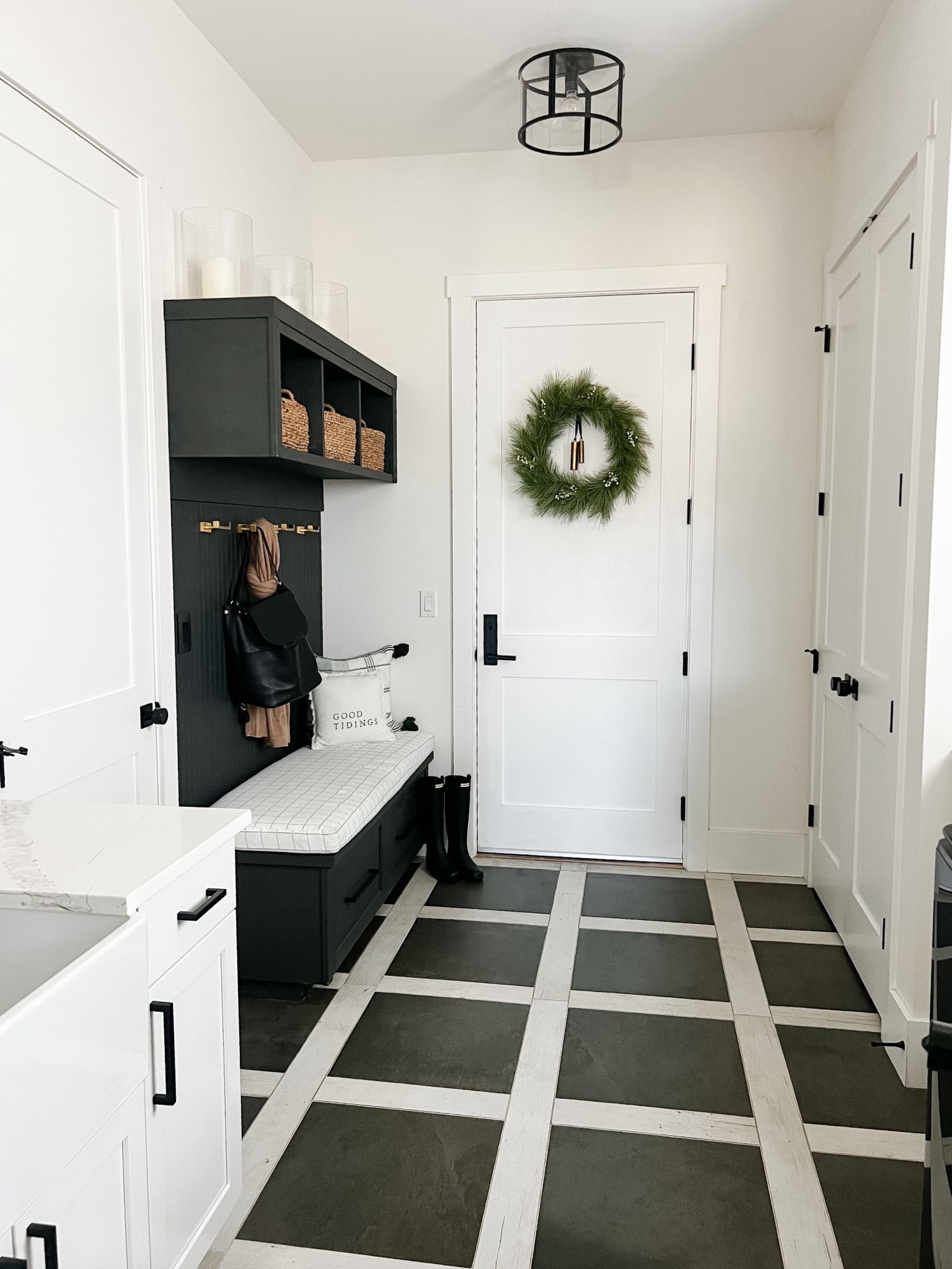 clean + cozy mudroom moment for winter ✨🌲
Loving the dark cabinetry, woven baskets, simple wall hooks, and a touch of greenery for an inviting seasonal update. This space stays organized and styled all season long.
Tap to shop the bench cushion, baskets, hooks, wreath, boots, and my favorite mudroom essentials 🤍

#MudroomDecor #LTKHome #LTKHoliday #EntrywayOrganization #NeutralHomeDecor #ModernFarmhouseStyle #HomeStorageSolutions #SeasonalDecor #OrganicModernHome #CozyHomeVibes #LTKSaleAlert
